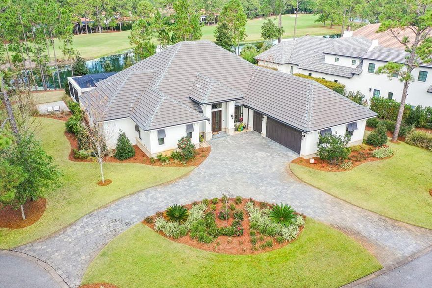 This stunning 4-bedroom lakefront home sits on the 5th hole of Sandestin's elite Raven Golf Club and will impress you from the moment you pull in the driveway.  Built by the local craftsman Doyle Owens, the attention to detail and designer level finishes easily separate this home from the rest on the market today.  This home can easily be described as ''Custom Elegance'', as no expense was spared.  One of the hardest decisions will be where to spend your time.  The interior is warm and welcoming, but the outdoor living is spectacular and includes beautiful lake and golf course views, a full outdoor kitchen with Cypress outdoor cabinetry, 3 TV's, speakers, fire pit, bar top dining, an oversized heated pool with jacuzzi, custom tile work, and so much more. A few of the numerous highlights on..