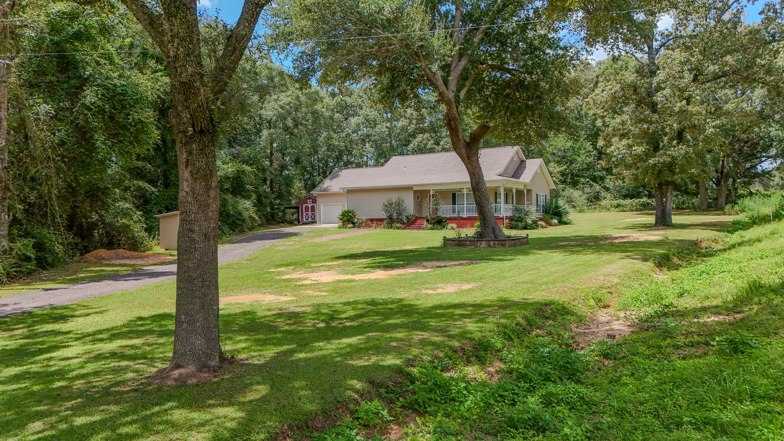 Assumable VA 2.625% loan @ $975/mo for veterans only! If you've been looking for a beautiful brick country home on a comfortable 1/2 acre homesite, don't miss this one. New roof and new HVAC in 2021. Laminate and tile flooring throughout and a huge kitchen with more oak cabinets than you could imagine, including a center island and pantry! The utility room is roomy with a utility sink, leading to the oversized 2 Car Garage. The master suite is right-sized with a double vanity, walk-in shower and walk-in closet. Outside living area with open patio is complete with TV connection, ready for game day or family fun. There is an outside storage building and the crawl space has been updated by ALPHA Foundations with lots of insulation and protective barrier to ensure more energy efficiency.