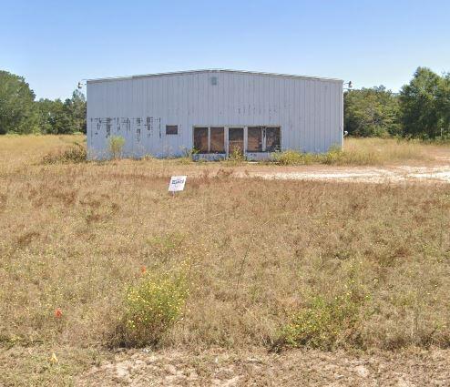 Property was not listed for sale. Placed on MLS for comp purposes. Buyer purchased just for land and will tear down metal bldg. Buyer had to rezone the property to commercial.
