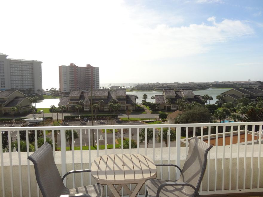 Priced to Sell ! Great views of the Gulf and Lake from this 5th floor, one bedroom unit. This 1 bedroom 1 1/2 bath condo sleeps 6 w/ hall bunk beds and a sleeper sofa. The kitchen features dark wood cabinets, granite countertops and a large eat-up bar, large private balcony w/ plenty of seating, unit comes completely furnished, including a stackable washer/ dryer. Ariel Dunes features 3 large pools, totaling 12,000 sq./ft. Ariel Dunes is in the Seascape Golf and Tennis Resort, a gated community offering amenities such as Golf, Tennis and Conference Center and on site restaurant '' Cabana Cafe'', as well as deeded beach access to over 2,000 ft. of beautiful white sand beaches.