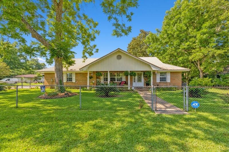Well kept ranch home in the heart of Baker. Home has 2 bedrooms and 2 bathrooms. Kitchen has been updated with new cabinets. Large heated and cooled Florida room could be used as a 3rd bedroom if the buyer needs the extra space. Home has a metal roof and fenced in back yard. There is a large detached shop in the backyard with attached carport. Shop is even wired for electricity. Make an appointment to see this one today. It won't last long.