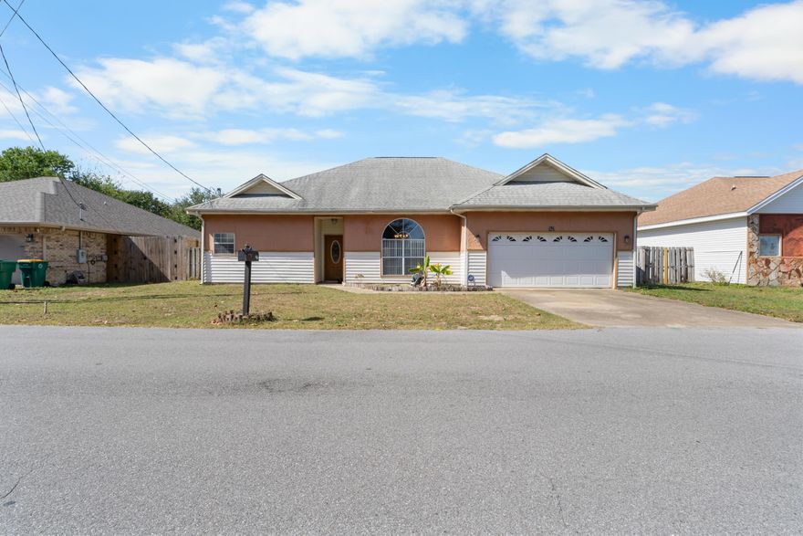 Welcome to this inviting 3-bedroom, 2-bath home in the heart of Mary Esther, just minutes from the beautiful white sands of Fort Walton Beach. Step inside to discover high ceilings that create an open, airy feel throughout the living spaces. The home features tile flooring in every room--both stylish and practical for coastal living.The primary bedroom offers generous space and comfort, while the additional bedrooms are well-sized, perfect for family, guests, or a home office. Outside, enjoy a spacious lot with a fully fenced, wood-gated backyard and a covered patio--ideal for outdoor gatherings, pets, or simply relaxing in privacy. The listed price includes the installation of a brand-new roof, which will be paid for by the seller. The seller understands that some minor storm wear from a past hurricane makes this the perfect time for an upgrade, ensuring peace of mind for the next homeowner.

Conveniently located near local shops, restaurants, and the beach, this home combines comfort, space, and locationeverything you need for easy Gulf Coast living.