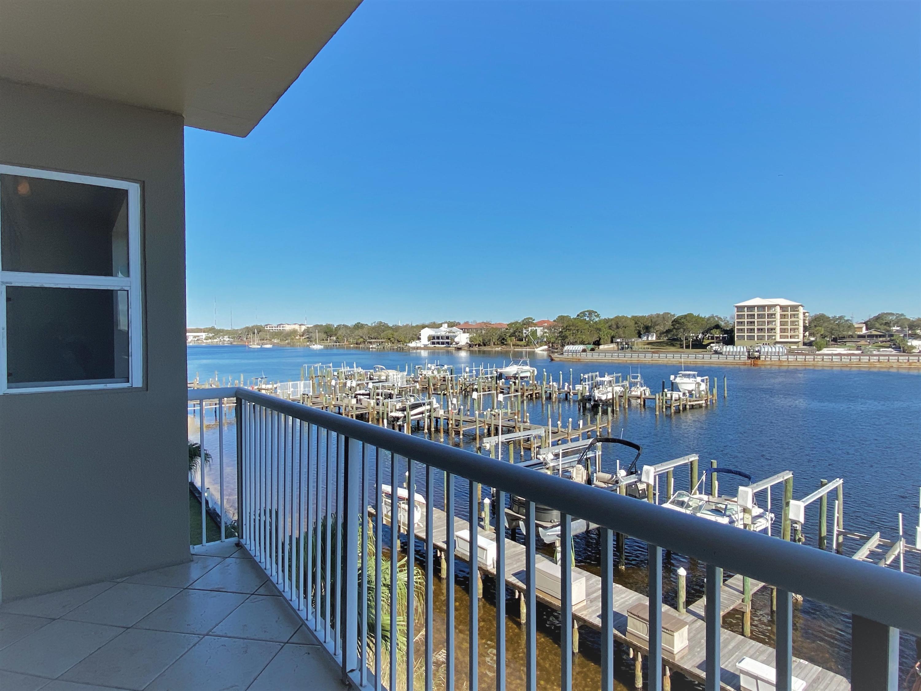 Welcome to waterfront paradise! Watch the boats stroll by, or enjoy the display of fireworks from downtown FWB on your private balcony. BOAT SLIP W/ LIFT INCLUDED IN SALE! This open and airy 2br condo has incredible water views from the common areas and master bedroom. Unit has large laundry room and plenty of storage for those who want to move right in! Recent upgrades include brand new LVP flooring, popcorn removal, fresh paint throughout, crown molding, stainless-steel appliances, lighting, & NEW water heater. Seller offering a $5,000 UPGRADE CREDIT at closing with acceptable offer!! Palm Court Yacht Club has gated entry, community pool & hot tub, storage lockers, assigned covered parking, marina, and beach walkover! 2021 HOA dues: $423.85/month and $33.61/month for boat slip.