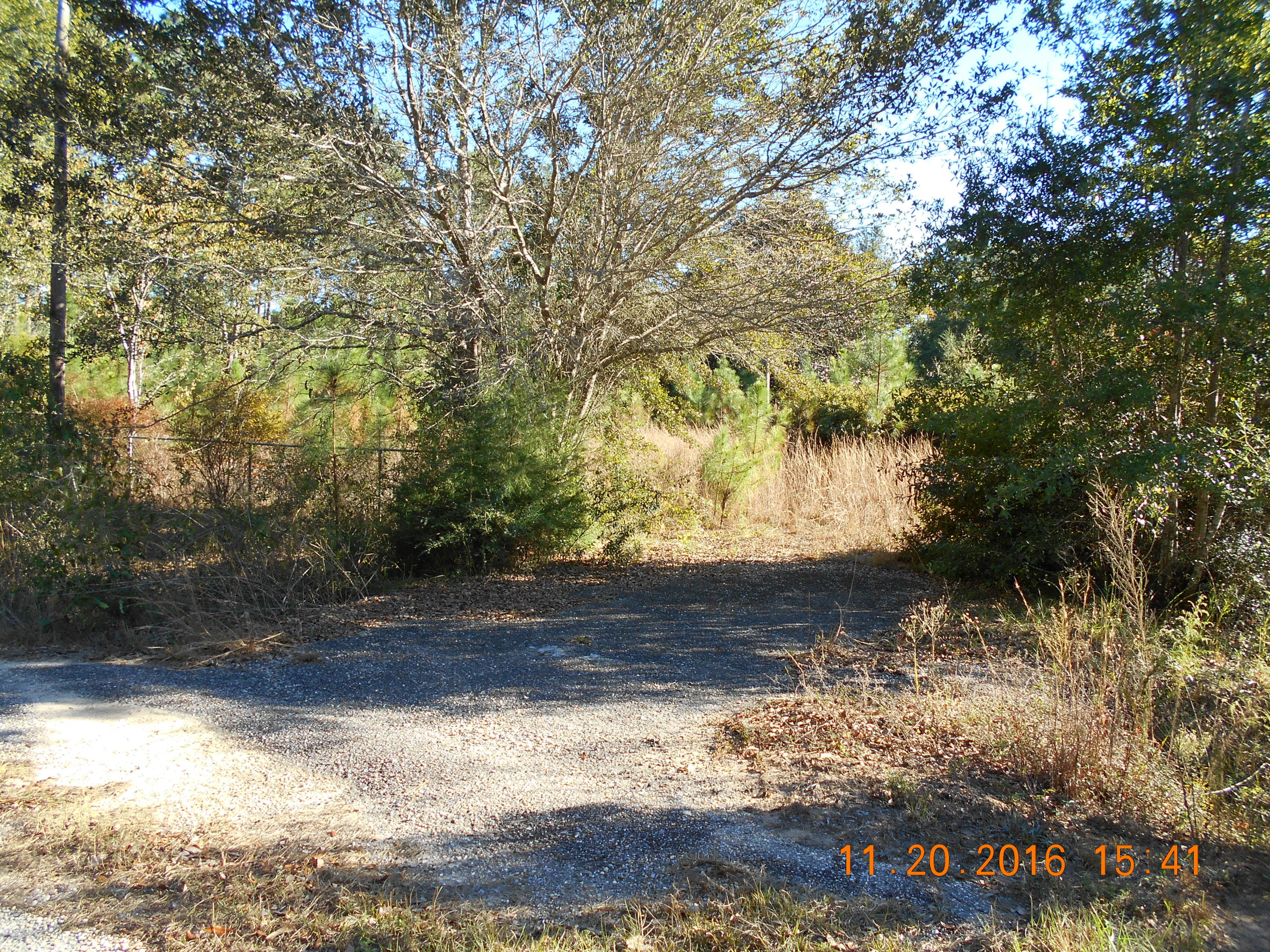Large .91 acre corner lot~ Fenced level lot just off the interstate and close to town~ Utilities are in place as there use to be a manufactured home there. This would make a beautiful home site for your new construction or manufactured home~ THIS WILL ALSO MAKE A WONDERFUL RV LOT~