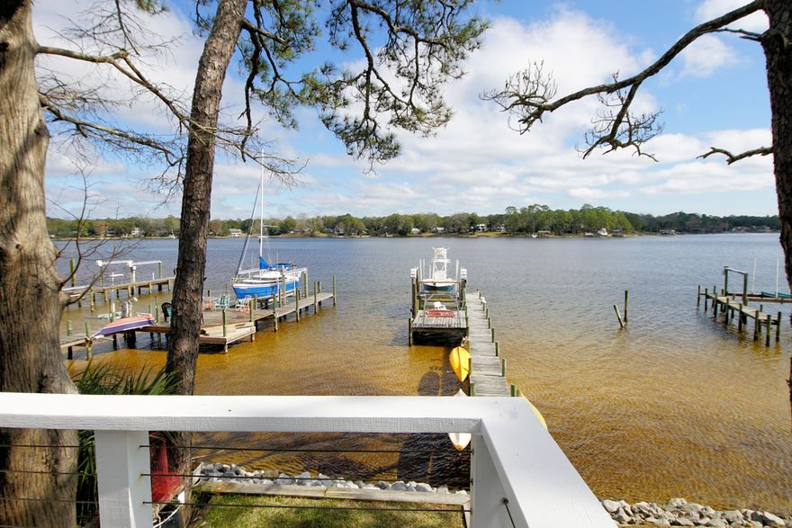 REMODELED, WATERFRONT Home w DOCK, BOAT LIFT and MORE!!! You will fall in love with the incredible views in this lovely property. Enjoy a relaxing lifestyle here in the ''Vale of Paradise'' w fireworks, water sports, fishing, BBQ's, bird watching and more!! Outside is a real treat and inside is just as fabulous! You will appreciate ALL the UPGRADES in this end unit townhome...hurricane impact windows/shutters, full kitchen remodel w hickory cabinets, pull out drawers, granite, under cabinet lighting, tile floors, newer roof, expanded deck and added stairs, enlarged patio, master bedroom remodel, new fireplace w mantel, gas, 2 masters...and views from almost every room! Affordable insurance too! See more details in the documents tab. Make your appointment today before it's too late!