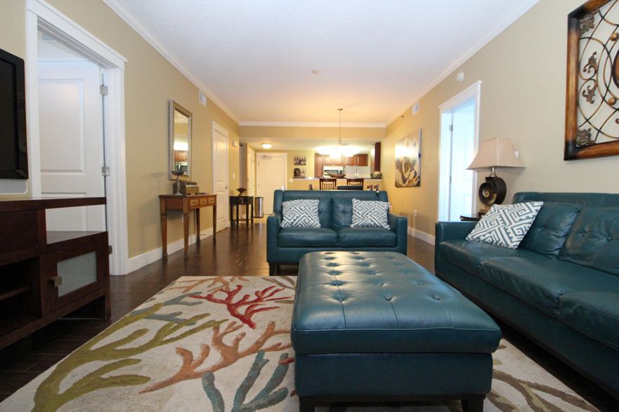 ESCAPE TO WATERSCAPE! Take a tour of one of the most desirable condominium complexes on beautiful Okaloosa Island. Step inside this unit with upgraded decor and furnishings to find an open floor plan with raised ceilings a spacious living room with crown molding and beautiful plank tile flooring throughout. Sliding glass doors lead out to the extended balcony. Dining area opens into the living area. Kitchen has granite counter space, stainless steel appliances and a pantry with washer and dryer. Split bedroom floor plan allows extra privacy from guests or children. Each bedroom has access to the balcony and private baths with large garden tubs for soaking and separate showers. There is also a bunk room and a half bath for your convenience. Waterscapes amenities include 490 feet of