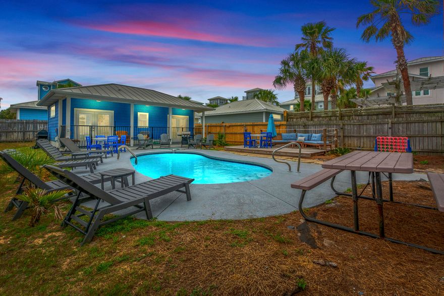 Two Houses in One! Welcome to your ultimate coastal retreat in the heart of Destin! This exceptional 3-story beach home offers the perfect blend of modern luxury and timeless architectural charm, creating an unforgettable oasis just 500 steps from the world's most beautiful beaches. With 5 spacious bedrooms and a charming carriage house, this home accommodates up to 18 guests, making it ideal for large families or vacationing groups. Multiple private balconies provide stunning Gulf views, while the backyard features a heated pool with a sprawling wood deck, perfect for relaxing or entertaining. Located in the vibrant heart of Destin, you'll enjoy all the area's top attractions right at your doorstep. Boasting an amazing lifestyle...this is the one you have been waiting for! More... Nestled in the coveted Crystal Beach neighborhood, this stunning property offers the perfect blend of comfort, convenience, and coastal charm. Just a short 500-foot stroll from the world-famous white-sand beaches, you'll find yourself stepping from your front door to your toes in the sand in no time. As you relax on the back balcony, enjoy a peek-a-boo view of the Gulf of Mexico, a reminder of the paradise that awaits you.

This home is truly two for the price of one, with a spacious 6-bedroom layout split between the main house and a charming carriage house. The main home, spread across three stories, is designed for both relaxation and fun. The first floor welcomes you with a cozy bunk room, perfect for the kids, featuring two twin-over-queen bunk beds. A full bathroom is conveniently located nearby, making it easy to freshen up after a day at the beach.

On the second floor, you'll find two king bedrooms, each with its own private en-suite bathroom and a private balcony offering a peaceful retreat to unwind. The third floor features a serene queen bedroom with access to a private balcony, providing the ideal space for a quiet getaway.

The separate carriage house offers even more room to spread out, with a king bedroom that opens up to the patio, plus a second room with a queen sleeper sofa and kitchenette, perfect for guests seeking privacy or a little extra space.

The bathrooms are equally luxurious, with the first-floor bath featuring a tub, shower, toilet, and vanity, and the second floor offering two spacious en-suite baths, one with a walk-in shower, separate tub, and his-and-hers vanities, the other with a walk-in shower and vanity. A third-floor bath with a walk-in shower and toilet completes the home.

The living area invites you to unwind with a cozy couch (that doubles as a queen sleeper sofa) and stylish accent chairs, making it a perfect spot for gathering with family or friends. The open layout flows seamlessly into the kitchen and dining area, where you can enjoy meals together at the dining table with seating for 8, or grab a quick bite at the breakfast bar with seating for 4.

The laundry room, conveniently located near the back door, includes a stackable washer and dryer, as well as an extra refrigerator for storing drinks or snacks for your beach days.

Outside, the fun continues with a private, fully gated backyard oasis. The pool is the perfect place to cool off or relax, surrounded by comfortable seating, umbrellas, and pool loungers. Whether you're enjoying a sunny afternoon by the pool or hosting a family barbecue, this space is designed for enjoyment.

This home is more than just a place to stayit's a destination in itself, offering everything you need for the perfect beach escape.