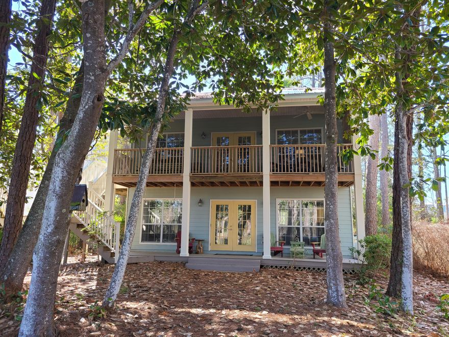 Experience the charm and nature of Old Seagrove in this well maintained and cared for 3 bedroom, 2 bath cottage overlooking the Canal that flows to Western Lake. Paddle to Western Lake and Watercolor from your private boat launch. A ten-minute stroll will take you into Seaside where you can enjoy award-winning restaurants, unique shops and the ambiance of a quaint coastal village. Close enough to walk or bike to everything. Natural landscaping leads right up to the canal dock. 368 Canal is on a quiet Cul-de-Sac and offers the ultimate in privacy.This home has been a vacation rental as On the Canal and is being sold furnished (with some exceptions) ) and is rental or Owner occupied ready. Experience the charm and nature of Old Seagrove in this well maintained and cared for 3 bedroom, 2 bath cottage overlooking the Canal that flows to Western Lake. Paddle to Western Lake and Watercolor from your private boat launch. A ten-minute stroll will take you into Seaside where you can enjoy award-winning restaurants, unique shops and the ambiance of a quaint coastal village. Close enough to walk or bike to everything...beach, galleries, fine cuisine, bike trails, markets, live theater, a family run bookstore, outdoor bazaars, and coffee shops. Natural landscaping leads right up to the canal dock. 368 Canal is on a quiet Cul-de-Sac and offers the ultimate in privacy.
This home has been a vacation rental as On the Canal and is being sold furnished (with some exceptions including Dining Table, Master Iron bed, artwork over Master Bed and Adirondack chairs on Master Balcony) and is rental or Owner occupied ready.  
This home has been newly painted inside and out, and a metal roof installed in 2020. Central heat and air compressor replaced in 2024, replaced hot water heater and washer and dryer installed in 2021.  The refrigerator is 2023, LG electric stove with smooth cook top and LG dishwasher are circ 2020. 
First Floor: The main entrance into this home is a foyer in which you will find the laundry room with full capacity washer and dryer. Up a half flight of stairs and then back down a half flight is the first-floor den, bath and queen bedroom. New wood flooring on this level. The den offers space for a double sleeper sofa, side chairs and mini fridge. French doors open off this room to a covered porch with Adirondack seating. From this porch, you can view the peaceful canal. The queen bedroom has pocket doors to close it off from the den area and is outfitted with bedside tables and lamps and a large closet with built-in drawers. The first-floor bath is off the den area and has a vanity sink and shower. 
The two-car garage connects to the Foyer and downstairs den.
Second Floor Common Areas: Up on the second floor, you will find the open kitchen, dining and living room all of which look out over the canal. Vaulted ceilings grace all rooms. Kitchen/dining area is tiled and living room/bedrooms have wood flooring. Quartz countertops and ample Oak cabinetry accent the kitchen. There are modern, newish (circ 2020 or newer) stainless appliances, including fridge with icemaker/door water dispenser, dishwasher, microwave and glass-top range. Breakfast bar wraps around and has the sink centered on it, allowing the chef to keep up with conversation in the living area. The dining area is adjacent to the kitchen and features room enough to have a dining table that seats six. There is a convenient grilling deck off the dining area. The comfortable Living room has room for a sofa, side chairs, coffee table and features a propane gas fireplace that is gas hook up ready. French doors lead from the living room to the screened porch which overlooks the canal, a perfect escape for the family. 
Second Floor Bedrooms/Bathroom: The master bedroom with Trey Ceiling also has a private outdoor balcony overlooking the front of house. Large hall bath serves second floor and features a garden tub/shower with sky light and a double vanity sink with Quartz counter tops. The third bedroom has size for bed, side tables and has a closet. 
Outside: Hot/cold outdoor shower. Parking for up to 4 cars in gravel driveway in addition to the two car garage. The home has a master bedroom balcony facing south and two covered porches (one screened) facing the Canal. 
Beach Access: The beach is about a 10-minute walk down lovely oak canopied dirt roads of Old Seagrove via the Dogwood/Thyme Beach Access. Seaside is just around the corner. The Nightcap Beach access is also just as close and offers a shaded trail to the beach. Seagrove Beach is all public beach so there is plenty of room to spread out.
Vacation Rental Revenue in '21 $43,899, '22 $43,000, '23 $40,900, '24 $32,807

