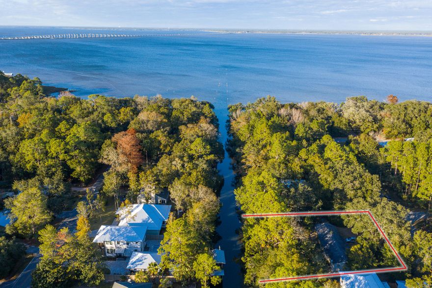 Incredible half acre lot located in Point Washington with 150 feet on the canal just 5 lots South of the Bay. This lot is perfect for building your dream home that has direct access to the Bay or sub divide and build two homes on this large parcel. Daughettes is one the most desirable neighborhoods within Point Washington being close to the white sandy beaches of South Walton.