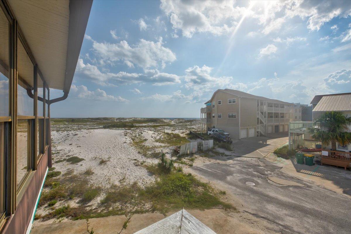 Awesome opportunity for a beach home. Just a few steps from access easement. This is a newly renovated townhouse with a beautiful view located on Holiday Isle. The home was renovated in 2015 and is move-in ready. Will make an awesome vaction rental.It has great rental potential with an easy walk to the beach. Enjoy the sunrise on the back balcony with your coffee and sunsets from the front balcony. The living area on the second floor has an open concept with vaulted ceilings, new modern cabinets with granite. The first floor features 2 bedrooms and 2 bathrooms . room out back to add a hot tub. being sold 'As is '