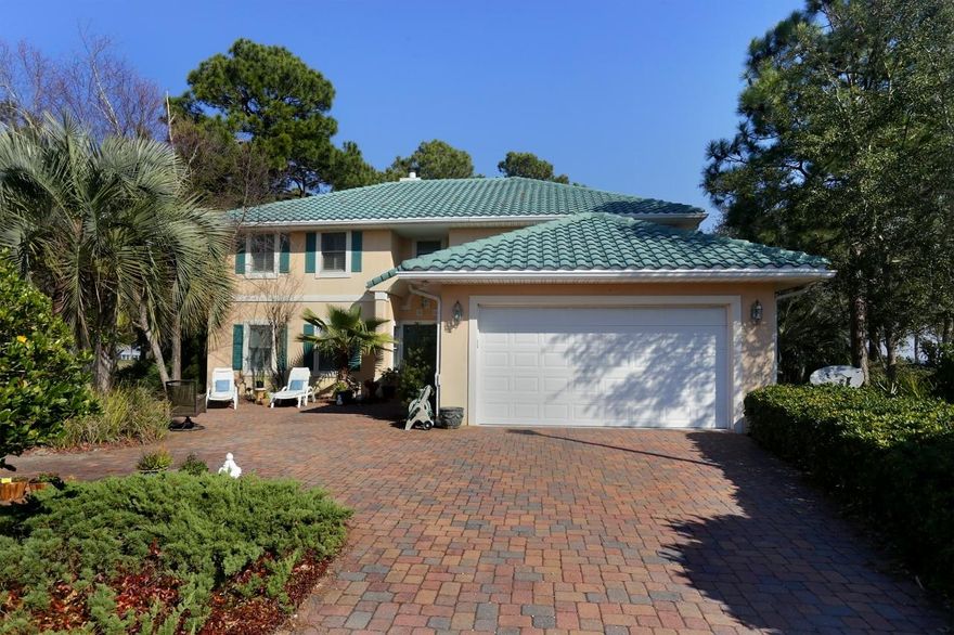 Experience Destin living at its finest! The views from this gorgeous bay front home are only beaten by the quality of construction and delicate care put into every detail of this recently redesigned golf course home. Located in the sought-after Emerald Bay subdivision and situated on the 16th green, you will undoubtedly enjoy living in one of the finest homes on the Emerald Coast. Built from Polystyrene concrete, whose long term benefit most notably includes energy savings, you will find that this is just one of the many features that separates this home from the rest. The private, first-floor master with access to the enclosed patio, the heated pool and extraordinary floor plan that seamlessly flows throughout the space are among some of the others. The gated Emerald Bay community also