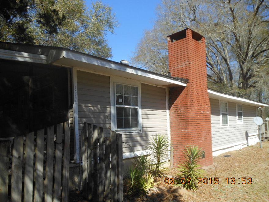 ONLINE AUCTION, APRIL 18 THRU 22. REGISTER AT www.homesearch.com. Older frame home with vinyl siding in country setting on 4 acres. Detached concrete block building built in 1985 has one car carport and extra kitchen. Fruit trees. Well and septic. No restrictions. Home needs some TLC. (See agent remarks.)