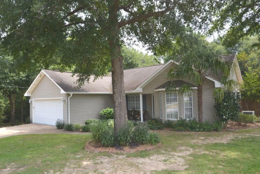 Pampered home on an acre of land! Many features are upgraded & most of your closing costs are paid at full price! The home's Foyer invites you in to the spacious Living Room w/cathedral ceiling, corner gas fireplace, & a view of the woodsy landscape. The Dining Area is currently used as an office & opens onto the 12x6 back porch w/adjoining patio & large privacy fenced area. The fenced area is not on the property lines-property goes behind the back fence & extends into the wooded property left of the side of the home; plenty of room for your workshop! Bay windowed Breakfast Nook makes a large Dining area. Country Kitchen comes fully equipped w/all stainless steel appliances & a Pantry. The Master Bedroom overlooks the wooded landscape; Master bath has a granite vanity & laminate flooring.