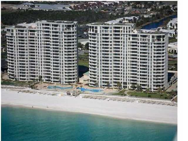 REDUCED 75K for quick sale. Seller is ready for offers! This incredible 17th floor 2 story penthouse is on the west side of Silver Beach Towers is a rare find. This condo has been well maintained by the original owners with many upgrades to include travertine floors, new carpet, new double ovens, new dishwasher, 2 new televisions, new granite countertops, new AC in 2014 and has been professionally decorated by Sandcastle Designs. Penthouse 1706 is a large 2 story condo with a total of 5 bedrooms, 5.5 baths with 2 master bedrooms and baths with Jacuzzi tubs and both have gulf views. There are views from the living area, upstairs sitting room and kitchen. A favorite feature rarely found is a double garage underneath the garage with closing doors. And, this condo has a large balcony to enjoy