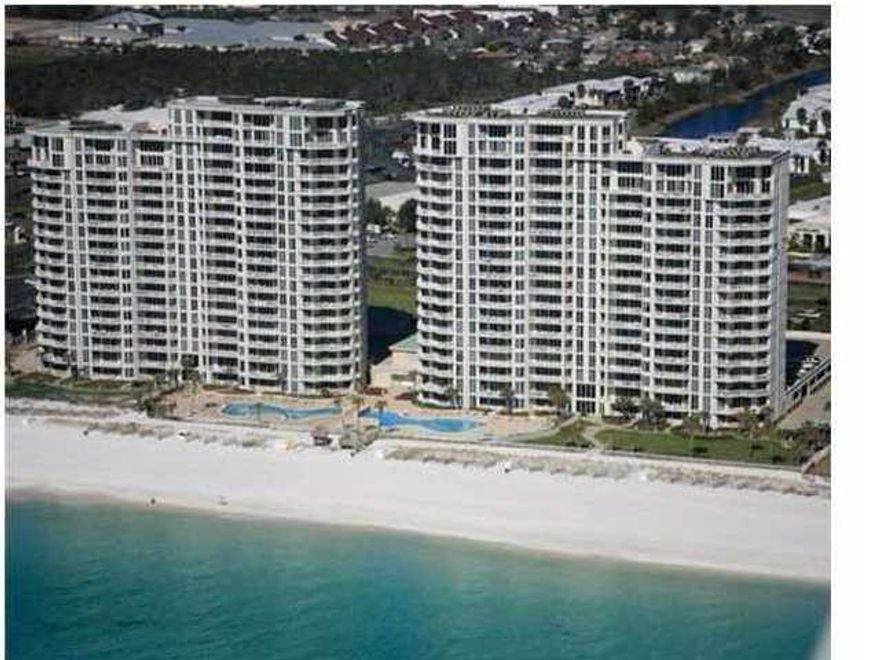 REDUCED 75K for quick sale. Seller is ready for offers! This incredible 17th floor 2 story penthouse is on the west side of Silver Beach Towers is a rare find. This condo has been well maintained by the original owners with many upgrades to include travertine floors, new carpet, new double ovens, new dishwasher, 2 new televisions, new granite countertops, new AC in 2014 and has been professionally decorated by Sandcastle Designs. Penthouse 1706 is a large 2 story condo with a total of 5 bedrooms, 5.5 baths with 2 master bedrooms and baths with Jacuzzi tubs and both have gulf views. There are views from the living area, upstairs sitting room and kitchen. A favorite feature rarely found is a double garage underneath the garage with closing doors. And, this condo has a large balcony to enjoy