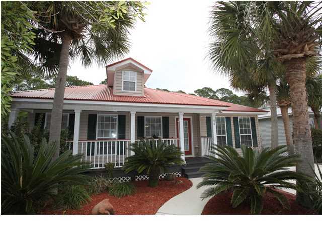Location, location, location!!! Walk to the beach and ride your golf cart to the golf course! This 3 bedroom 2.5 bath home is in the beach community of Sea Dunes and just a short distance to the beach walkover with access to the beautiful Gulf of Mexico, Oyster Lake and the golf course. Never rented this LOW MAINTENANCE home is situated on a large private lot that backs-up to the state forest. This COMFORTABLE two story has an open floor plan, spacious kitchen, dining room, living room and master bedroom all on the entry level. The kitchen is complete with granite countertops, custom cabinets, stainless appliances and bamboo flooring that extends out into the dining area. 96 Tradewinds is immaculate and has been kept that way by the owners. Sea Dunes subdivision is designed around
