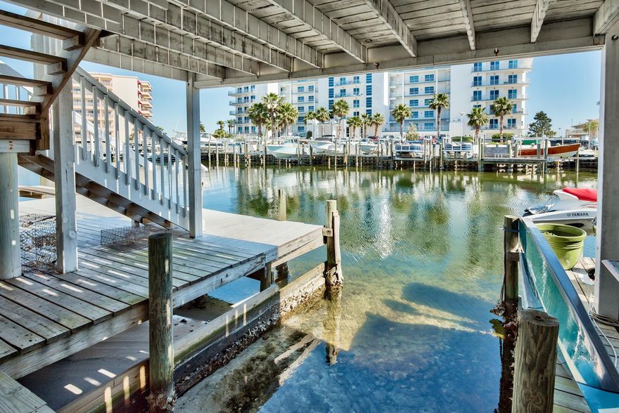 Phenomenal opportunity to own a waterfront property in Destin with a BOAT SLIP! Enjoy the coastal lifestyle right outside your door with 20 feet of canal frontage, a deeded slip that can cater up to a 25 ft. boat and direct access to the Destin Harbor, East Pass & Gulf of Mexico. This is a prime location with multiple beach accesses in close vicinity including Norriego Point that you can easily paddle board to. Plentiful dining and entertainment options nearby by water taxi, boat or bike. This 3-story townhome has been beautifully renovated and is sure to impress offering incredible views, an open floor plan, great balcony and 1-car garage and 2 dedicated parking spaces. The lower level even offers an optional bonus area that could be converted to a full bedroom & bath (already plumbed).