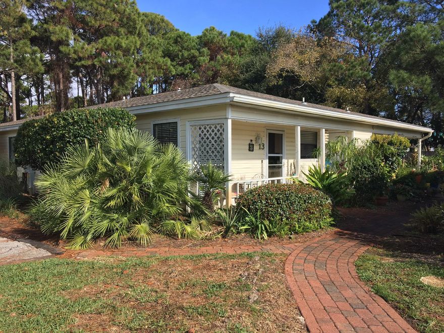 This one-story home includes tile flooring throughout, an open floorplan with spacious updated kitchen with eating area, as well as a large, bright bedroom. Convenient parking right outside your door and within walking distance to the beach. Great location-easy drive to Destin or 30A! Perfect residence, rental property, or second home! Upgraded cabinets, granite, and lighting in kitchen. New hot water heater-2014 New Dishwasher-2016. Refrigerator to convey ''AS IS''.