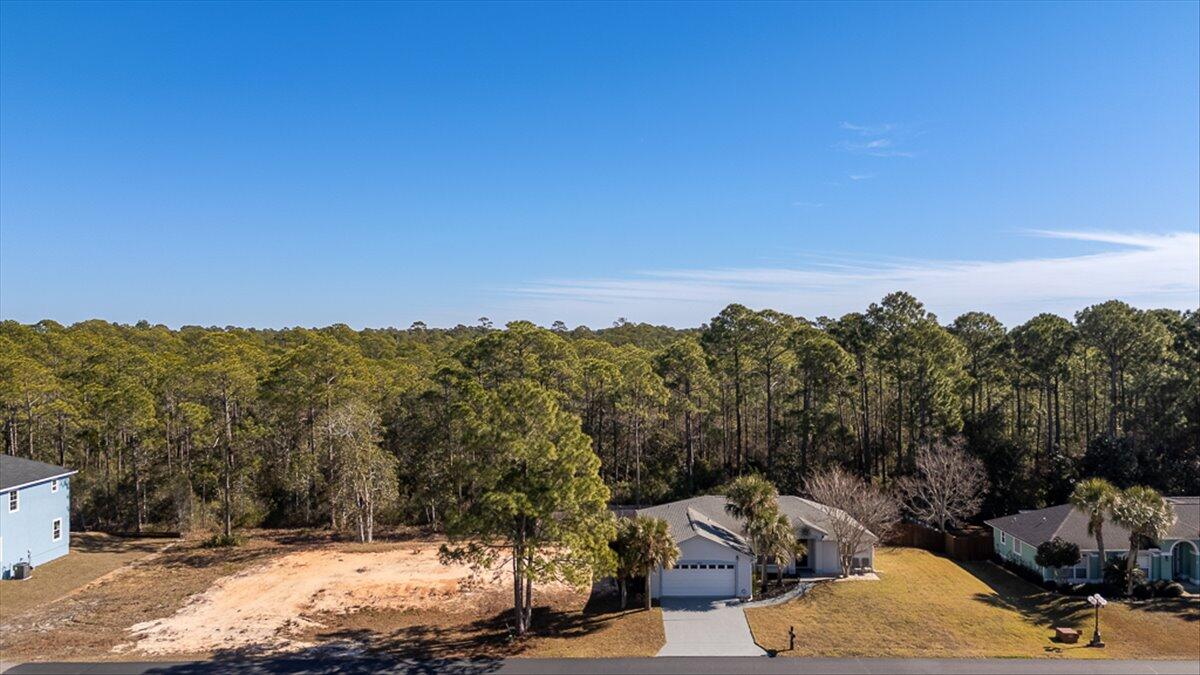 PRIME BUILD-READY LOT IN EXCLUSIVE WATERFRONT COMMUNITY!! Seize this rare opportunity to own a completely cleared, build ready lot in a private, amenity-rich community just 1/2 mile from the stunning Santa Rosa Sound and Intercoastal Waterway. Whether you're envisioning a serene coastal retreat or an investment property, this lot offers the ideal foundation for your vision. Enjoy DIRECT WATER ACCESS, with a PRIVATE COMMUNITY BOAT LAUNCH and DOCK, perfect for effortless days on the water. Nestled in a peaceful yet highly desirable location, this property provides the perfect blend of seclusion and convenience- offering the COASTAL LIFESTYLE you crave without sacrificing accessibility. Opportunities like this doesn't last long! Have your own slice of paradise and start building your dream today! *Site plans already approved by the county and HOA! More pictures to come...