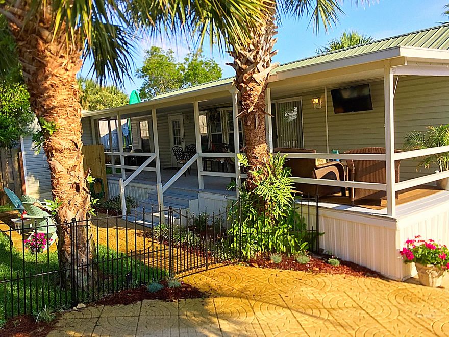 Beautiful Beach Home with in walking distance to the Gulf Of Mexico.Features 2 bedrooms and one full bath,full kitchen with new appliances,large covered porches,large private fenced yard,cooled storage unit with tons of extra closet and storage space,brand new central heating and air unit,metal roof,lush landscaping,plenty of parking,and additional heated outdoor shower.Quiet private corner lot, and low HOA's! This adorable cottage would make a great income property!This listing won't last long! Listing Agent is a licensed FL Realtor.