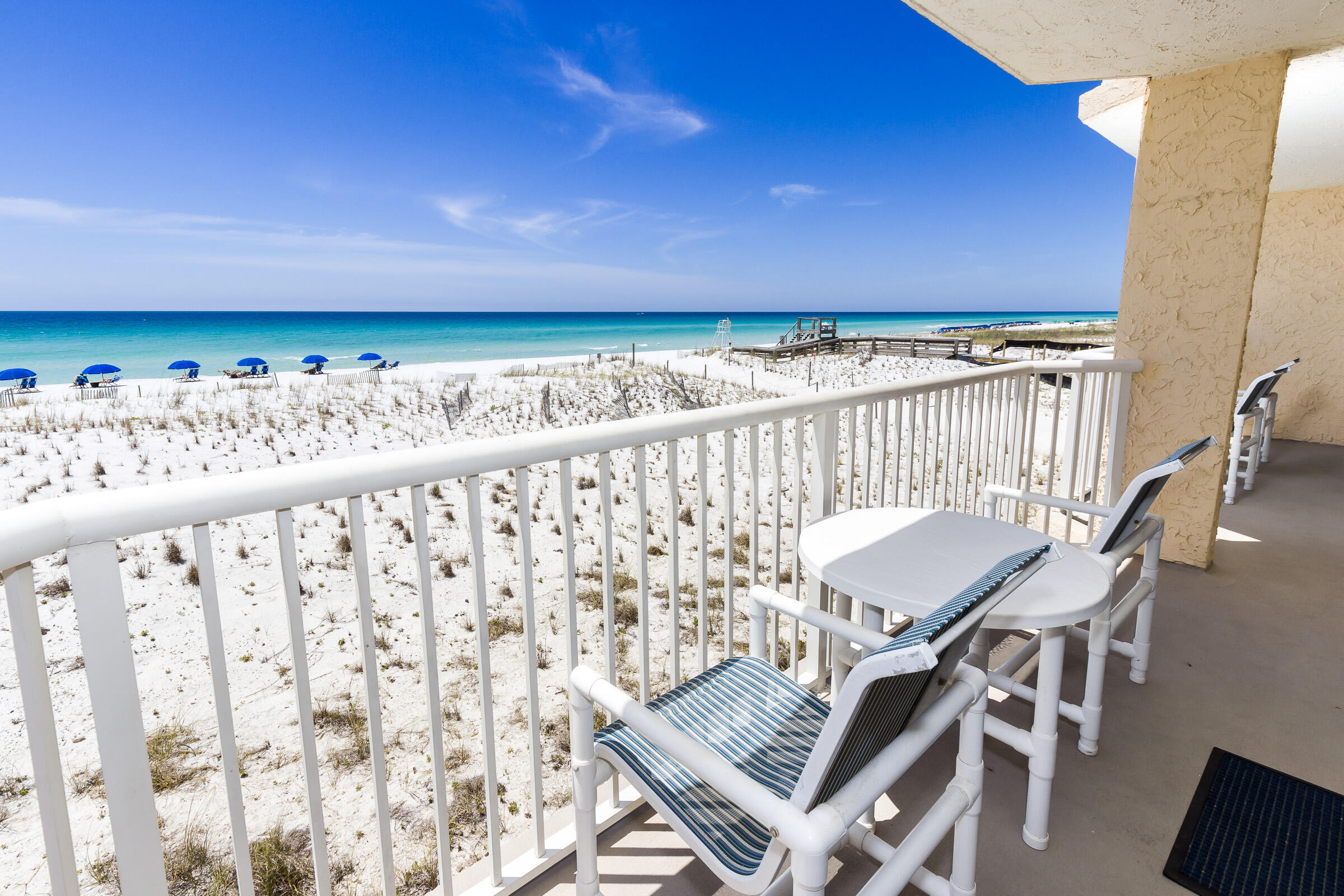 A spacious home away from home! With an amazing view of the pristine Gulf of Mexico, this two bedroom two bathroom condominium , leaves little to be desired. This unit was recently remodeled to include beautiful granite kitchen countertop, lovely tiled baths, and flooring. One bath has a walk in shower and the secondary bath has a tub with tile surround. Both bedrooms have flat screen TVs. Laundry room is complete with new washer and dryer. An open and bright living room hosts a contemporary beach theme connecting the inside to the wonderful scenes outside, which can be viewed from the large gulf facing 2nd story balcony. The large living room has a 65'' flat screen TV. HOA fee includes A/c and heating monthly costs. Gated covered parking not assigned. New Paint project on building !