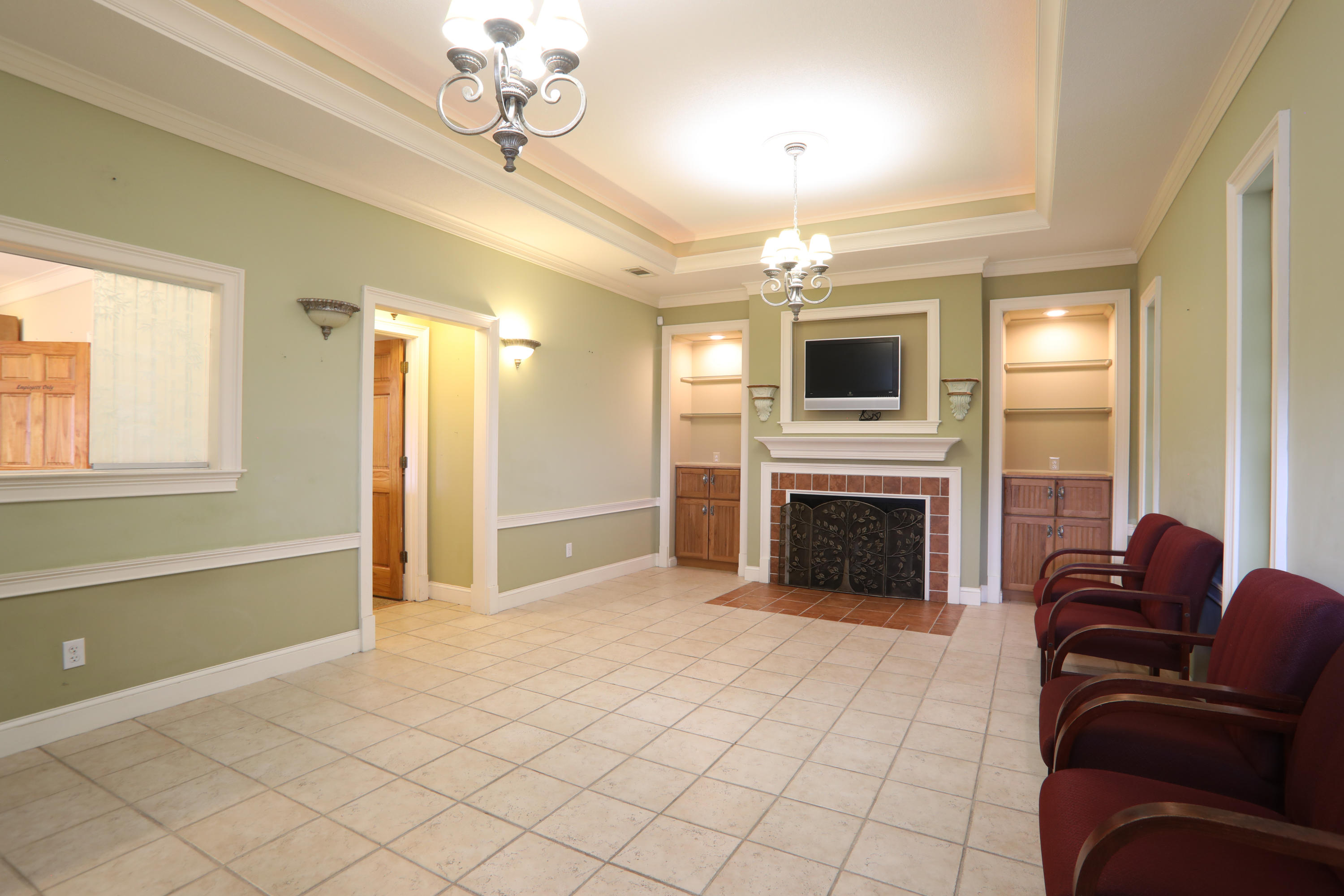 ***Lease Option Available 1800 a Month-10k down-Professional Office in Crestview with public parking at entrance & sidewalks. Prior use as a Medical Office. Walking distance to restaurants and other local businesses. Walk in entrance to the waiting area with fireplace and Reception Window for patient registration. Enter into the Hallway where you have One Office with built in shelving, 2 half baths on each side, 4 exam rooms with Sink areas, 1 with a Shower, Small Lab Room, Utility Room with Sink, Secondary office area and entrance, Kitchen has full size Stove/Oven & Small Refrigerator which leads to an extra room & fireplace. Come make it your own. Interior was previously remodeled in August 2006 which included Insulation, electrical, mechanical, plumbing and Central Air system