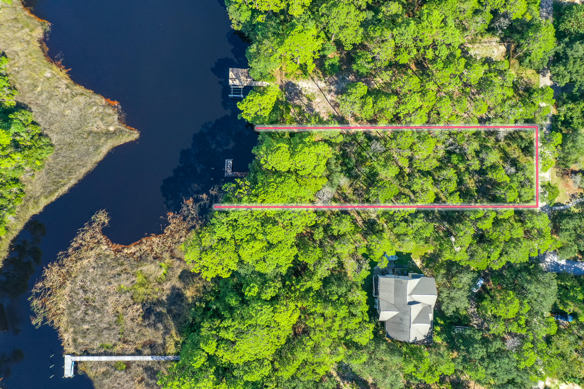 Peacefully nestled in this incredible location on beautiful Lake Powell in Inlet Beach. This property boasts a just over 1/4th acre lot (.464), with over 80' feet of lake frontage. With NO HOA, this property is the perfect opportunity for a primary residence, vacation rental, or second home! Build your dream home in the perfect location north of 98, but just a short walk to the beach, and a public access with lots of parking! Don't hesitate to request more information today!Buyer to verify all information and dimensions. Information is deemed reliable but not guaranteed.