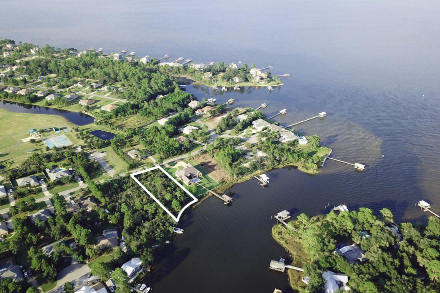 This large bayou front lot is located on Buck Bayou with deep water access to the Choctawhatchee Bay. Boasting 110 ft of water frontage, this lot provides more than ample space to build your dream home with southern facing exposure towards the bayou. Conveniently across the street is a community park and Grand Boulevard is just down the street with shopping, dining, and a Publix grocery store. Come enjoy all that waterfront living has to offer.