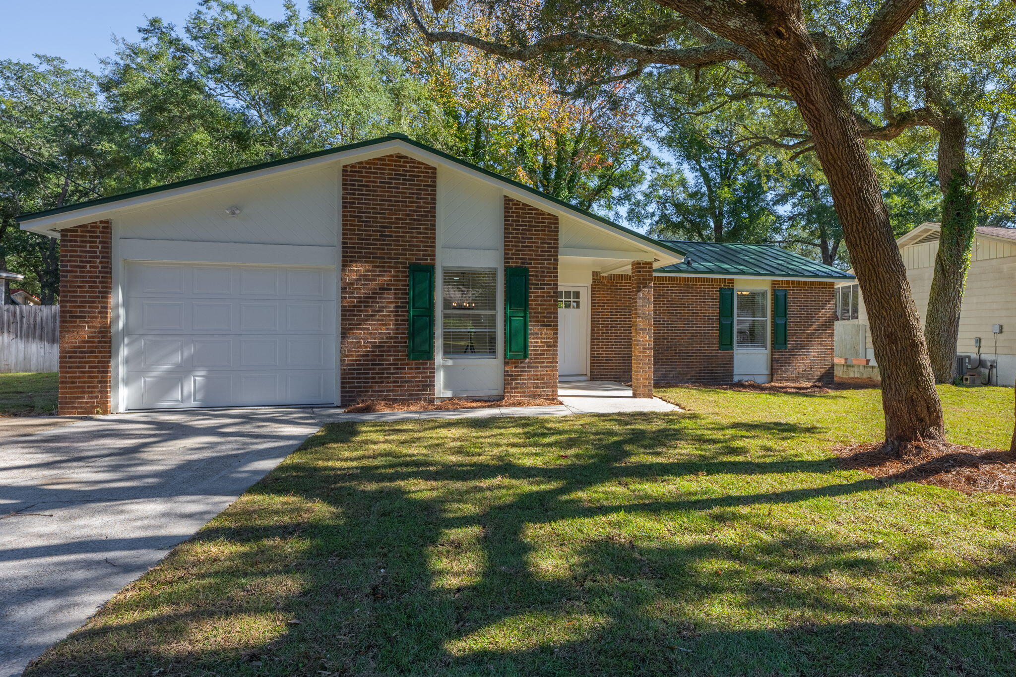 This 3-bedroom, 2-bathroom home in Niceville offers 1,397 square feet of beautifully updated living space. From the moment you walk in, you'll notice the thoughtful upgrades and open floor plan designed for modern living.Practical updates make this home a smart choice. A brand-new AC, new water heater, and a standing seam metal roof ensure durability and efficiency. Outside, fresh landscaping adds curb appeal, and the new garage door and opener bring extra convenience.Brand-new LVP flooring runs throughout the main areas, while the bedrooms feature plush new carpet for added comfort. The kitchen has been completely refreshed with new cabinets, updated countertops, and all-new lighting, creating a bright and functional space you'll love to cook in. Both bathrooms have been fully updated with stylish new vanities, mirrors, and fixtures. The primary bath features a stunning new shower that feels like a personal spa. Every detail, from the new trim to the fresh lighting throughout, enhances the home's contemporary vibe.

This home is move-in ready and waiting for you! Schedule a tour today and experience all the updates for yourself.