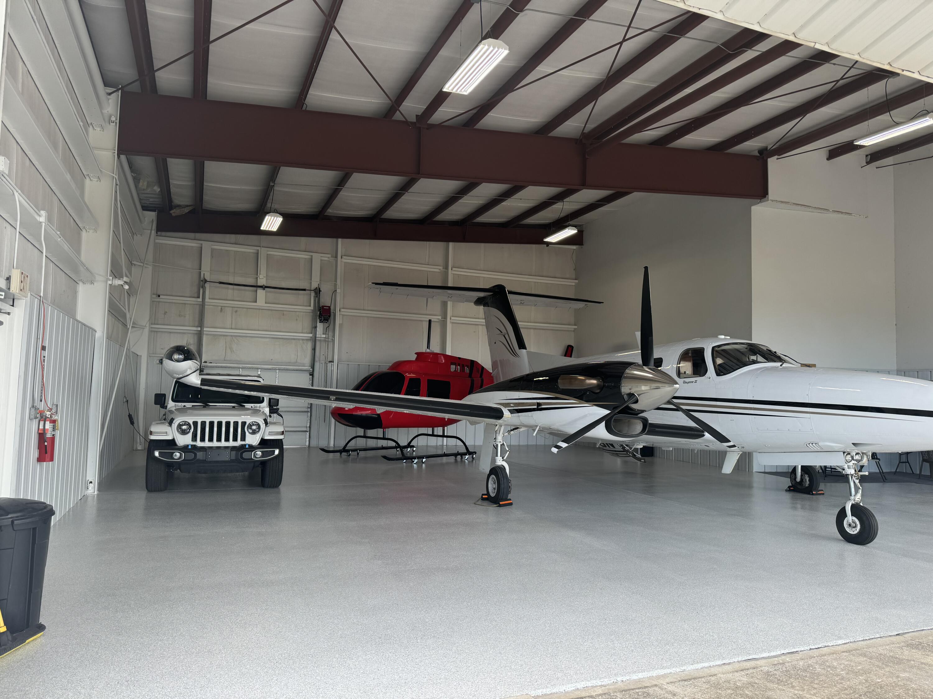 Renovated with newly done floor, freshly painted and extra concrete added too! The Destin Airport (DTS), located in the heart of Destin, Florida. You can rest at night knowing that your investment is safe and sound, out of the elements, covered, and awaiting your arrival! Nothing beats parking in your private hangar and climbing into your plane or helicopter. No parking in the hot parking lot and trekking to your plane that has been cooking in the hot Florida sun and being bombarded with salt and sand. Your personal aircraft deserves better. The related ground lease matures in approximately (16)-years, on July 11, 2040. The conditioned metal building contains manual swing doors and is oriented at a prime end-cap location, adjacent to the taxiway, and convenient to the FBO to utilize the host of supporting aviation supporting aviation services. Hangar Depth: 50' Height in Center of Hangar: 15' Swing-Door Opening Width: 43' Tail Clearance: 14'. Please note the aircraft, vehicles, and other personal items are NOT included in this subject listing. Destin Executive air terminal offers exceptional service, luxurious accommodations, and the most competitive rates.