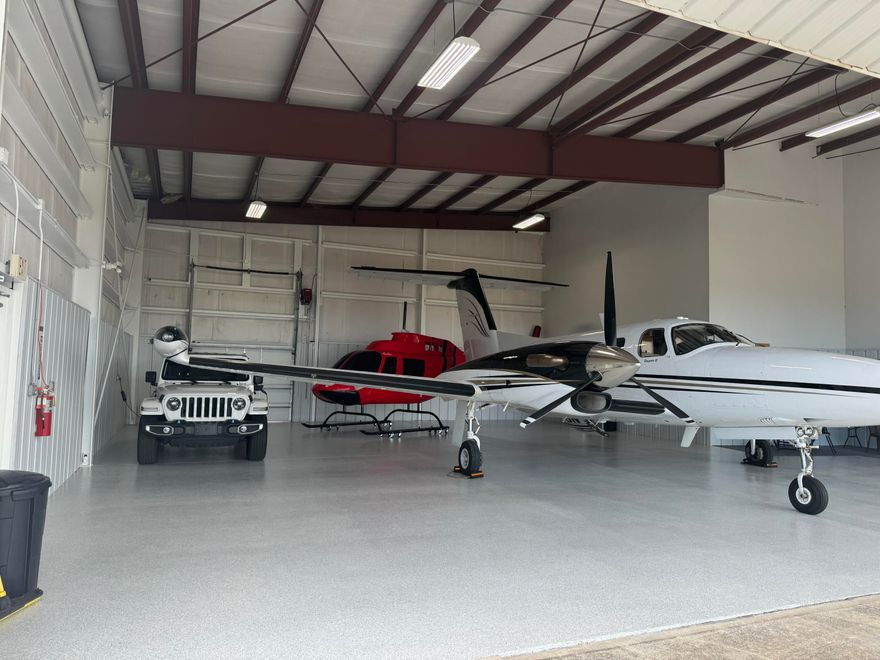 Renovated with newly done floor, freshly painted and extra concrete added too! The Destin Airport (DTS), located in the heart of Destin, Florida. You can rest at night knowing that your investment is safe and sound, out of the elements, covered, and awaiting your arrival! Nothing beats parking in your private hangar and climbing into your plane or helicopter. No parking in the hot parking lot and trekking to your plane that has been cooking in the hot Florida sun and being bombarded with salt and sand. Your personal aircraft deserves better. The related ground lease matures in approximately (16)-years, on July 11, 2040. The conditioned metal building contains manual swing doors and is oriented at a prime end-cap location, adjacent to the taxiway, and convenient to the FBO to utilize the host of supporting aviation supporting aviation services. Hangar Depth: 50' Height in Center of Hangar: 15' Swing-Door Opening Width: 43' Tail Clearance: 14'. Please note the aircraft, vehicles, and other personal items are NOT included in this subject listing. Destin Executive air terminal offers exceptional service, luxurious accommodations, and the most competitive rates. 
