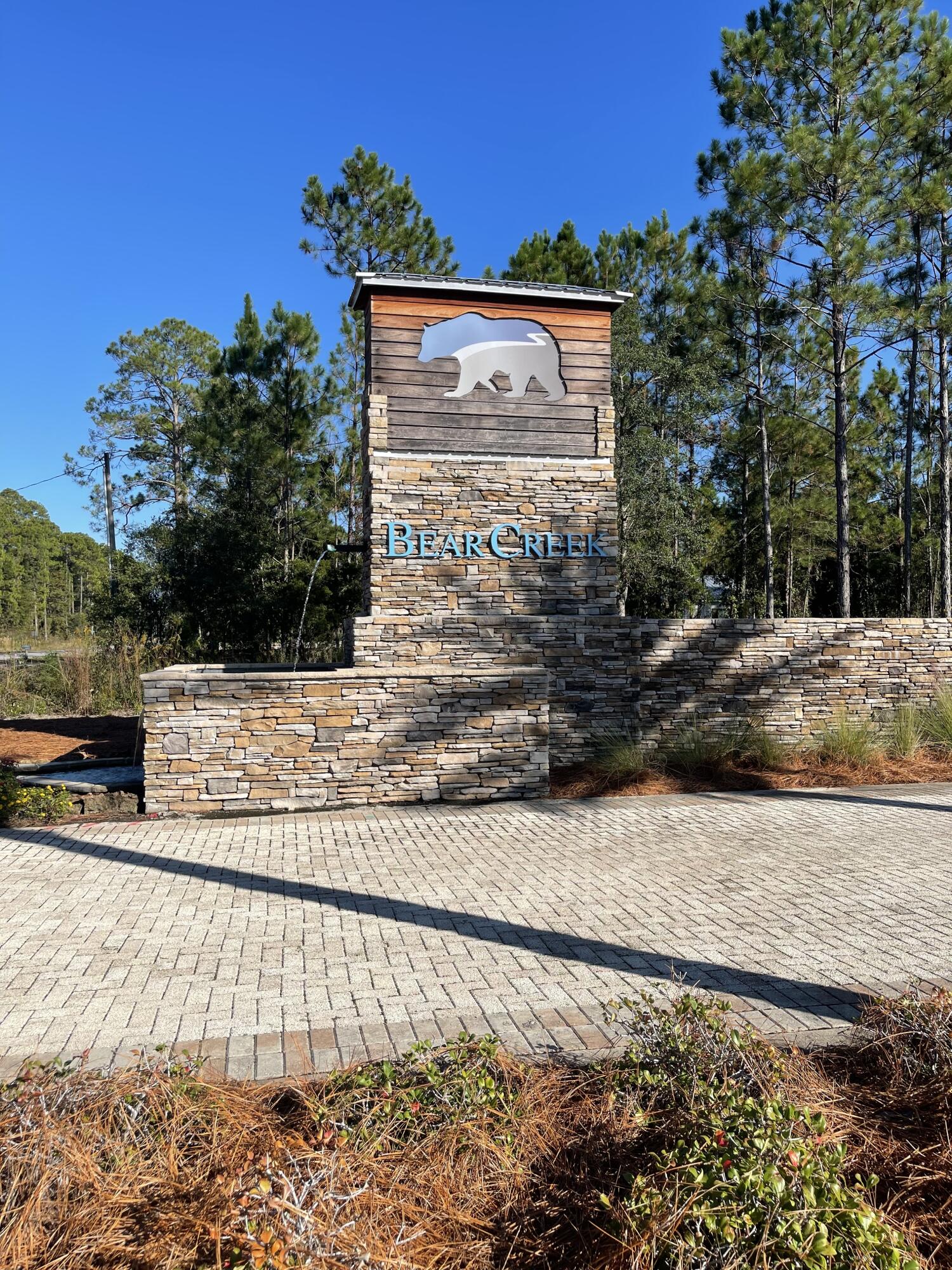Photos coming soon!!!!  This is a fantastic lot to build your Dream Home in Bear Creek.    Bear Creek is a gated community which is near Choctawhatchee Bay, the Emerald Coast and the beautiful beaches of 30A. This neighborhood has high class amenities like Tennis, Pickle ball, Basketball Courts, a Fitness Center, a Playground for the kids and a Community Pool. The lot is high and dry, in an X flood zone with no wetlands and located just steps to all of the Bear Creek amenities.