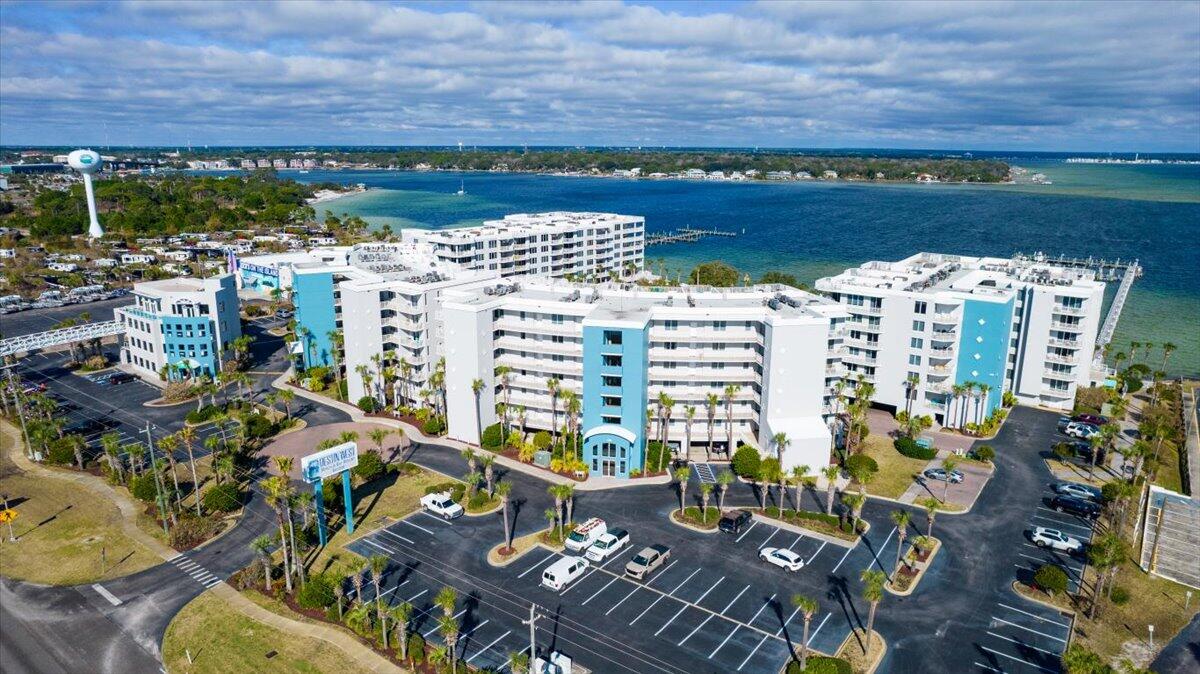 If you love the sugar white sands and sparkling Gulf waters, AND the fun activity of water sports & access to the Bay/Intercoastal Waterway, this property offers it all! This totally remodeled and renovated 1 bdrm, bunk rm, 2 bath, popular Lanai Level condo overlooks the Lazy River w/ peeks of the Bay through lush tropical foliage! What a perfect vacation destination or private beach getaway! No stone unturned,upgrades too numerous to list, PLUS a private garage for keeping your vehicle out of the salt air and storing beach/bay/water toys. Condo is freshly painted, new wood look tile flooring throughout, tiled baths, all new appliances(w/d combo, stove,fridge,d/w,water heater),ceiling fans, new toilets & vanities, new kitchen cabinet & quartz countertops,and all new furniture, continued..