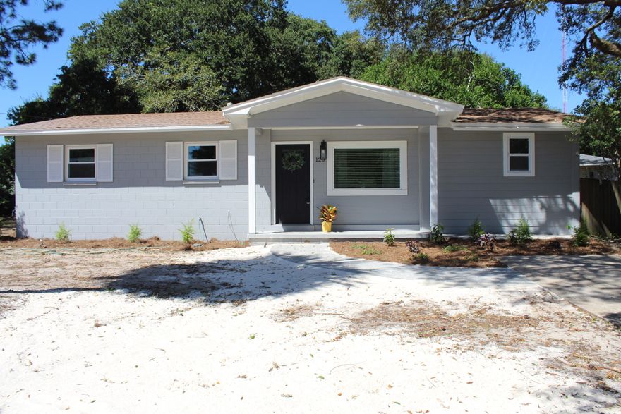 Welcome home to this freshly updated 4 bedroom, 2 bath home on a corner lot in beautiful Ft Walton Beach!  You will love the open concept living space and split bedroom floor plan. New luxury vinyl plank flooring, neutral paint throughout.  The kitchen has new, bright white cabinets topped with stunning granite and stainless appliances. There is a window over the kitchen sink, and a large island with breakfast bar seating. The walk-in pantry and laundry room are just off the dining area.  The kitchen and dining area is open to the living room, perfect for entertaining & relaxing. The main bedroom has an en suite bathroom with double vanities and custom tile shower, and a walk-in closet. The hall bathroom has been updated with beautiful tile surrounding the tub. LOTS of upgrades & updates! This home has undergone a total transformation with new light fixtures, new doors and windows a couple months ago mid-2022.  (*The previous owner said: new roof April 2021; new water heater 2019; HVAC and new ductwork 2015-2016; new loose insulation added to attic space.) There is a large Florida room accessible from the dining area, which adds flexible indoor/outdoor living space for your enjoyment. The backyard has mature trees, including a large fig tree--pick delicious, healthy fruit from your backyard. There is a detached garage/workshop, which is also accessible from the backyard--As-Is condition. The property has a sprinkler-system that is believed to be in working condition and conveys As-Is. 
This home is a 1964 Florida cottage concrete-block home with some siding, which was built to last.  Block homes are considered energy-efficient, fire-resistant, noise-reducing, pest-resistant, and low-maintenance.  This could be your perfect place to call home! Conveniently located just a few miles from the sugar-white sandy beaches of Okaloosa Island, and close to military bases, schools and shopping.  
*All information believed to be accurate; buyer to verify all facts deemed important.