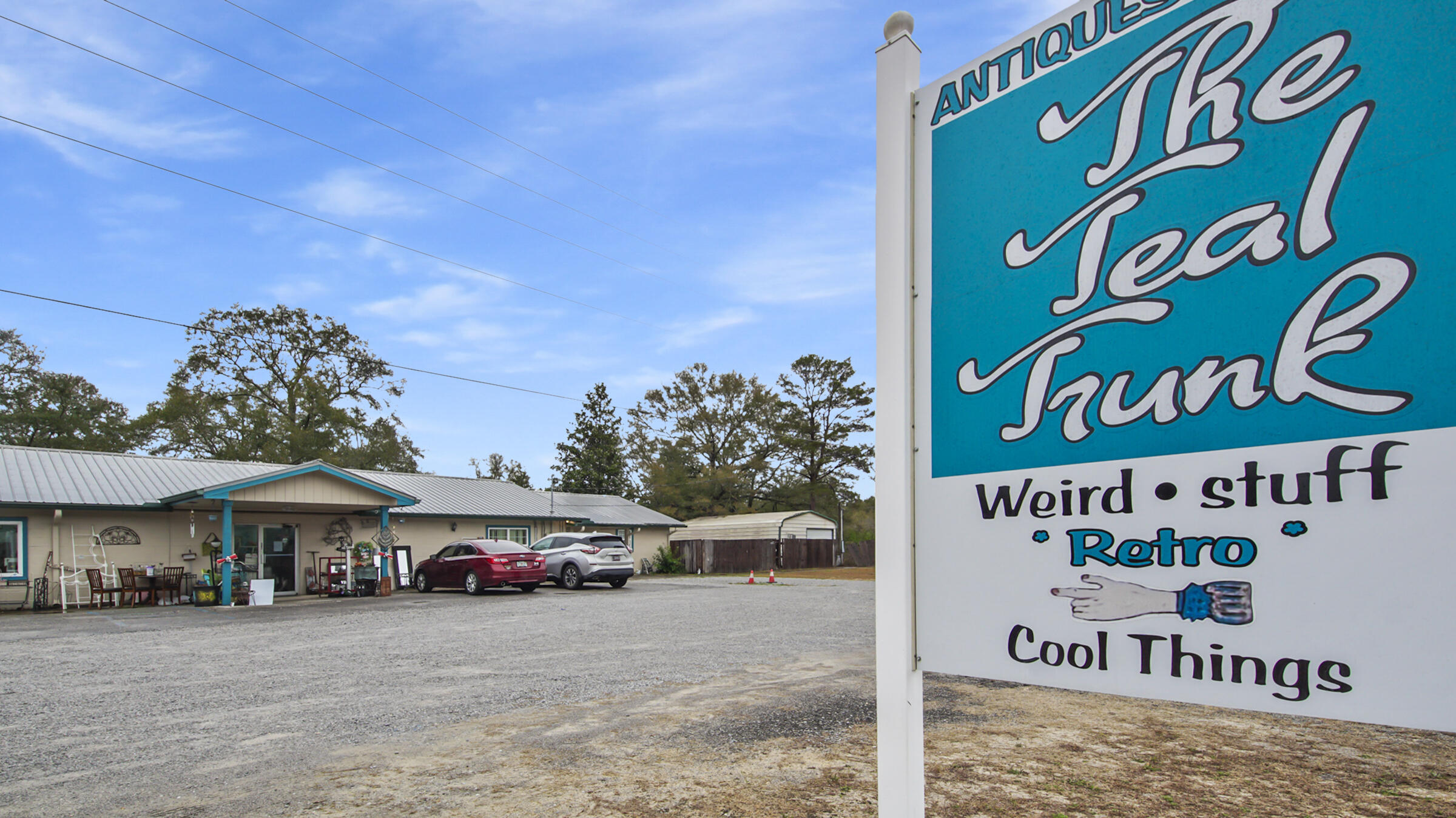 Welcome to the Teal Trunk! This 4562 sq. ft. building is currently being used as an indoor flea market! There are 33 Vendors and it is open part-time Wed-Sun. Vendor rental is 1.50 per sq. ft. There is an attached 1Bed/2Bath apartment that can be rented out for personal or commercial use. A section of the bldg. was plumbed for a hair salon and a vacant metal building can also be rented out on the same parcel. Ingress/Egress is via circular driveway from Hwy. 90/Wilderness Rd-perfect for deliveries! There is plenty of room for a food truck also! This turn key business is a money maker and needs a full-time operator to reach it's full potential! Work and LIVE here! Combined gross commissions/rental average $7000. per month. Call to book your private showing today!