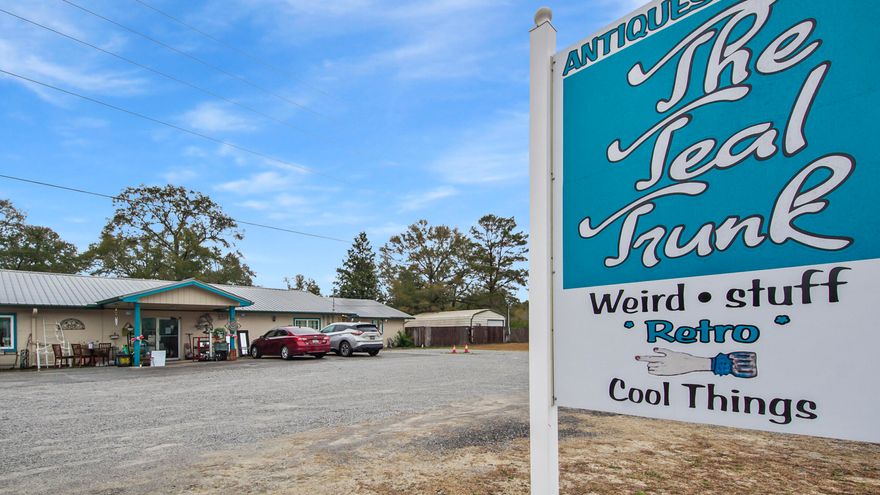 Welcome to the Teal Trunk! This 4562 sq. ft. building is currently being used as an indoor flea market! There are 33 Vendors and it is open part-time Wed-Sun. Vendor rental is 1.50 per sq. ft. There is an attached 1Bed/2Bath apartment  that can be rented out for personal or commercial use. A section of the bldg. was plumbed for a hair salon and a vacant metal building can also be rented out on the same parcel. Ingress/Egress is via circular driveway from Hwy. 90/Wilderness Rd-perfect for deliveries! There is plenty of room for a food truck also! This turn key business is a money maker and needs a full-time operator to reach it's full potential! Work and LIVE here! Combined gross commissions/rental average $7000. per month. Call to book your private showing today!