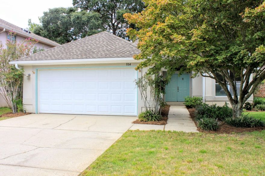 **PRICE MODIFICATION** Welcome home to 934 Shalimar Pointe Drive located on the third fairway in the desirable gated Shalimar Pointe Golf Course community. This three bedroom, two bathroom split floor plan, open living concept home is nestled among gorgeous, mature oak trees in a serene park like setting. Enter the property through double doors as you're welcomed into the foyer by double columns and newly laid wide plank gray tile. The roomy living area has vaulted ceilings, laminate warm 'wood' flooring, and a fireplace. The spacious, eat-in kitchen features the same newly laid wide plank gray tile as the foyer, tons of counter space, an island, breakfast bar, under cabinet lighting, and lots of big windows that let in great natural light. Enjoy your time in the heated/cooled enclosed sunroom while you look out over the golf course or on the durable, long lasting Trex deck in the backyard. The master suite features a multitude of large windows, vaulted ceilings, and tile floors.  The master bathroom has a shower/bath combo, double vanity sink, and a HUGE walk in closet.  On the other side of the house are two additional bedrooms with tile floors and a shared bathroom.  A new 30-yr dimensional shingle roof was installed in 2016. A Rinnai tankless hot water heater was installed in 2016. The HVAC was replaced in 2010. Buyer to verify all dimensions.