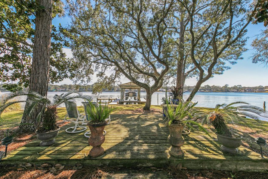 WATERFRONT home perfectly nestled on Cinco Bayou in Ft. Walton Beach!!  Enjoy an array of conveniences from both boat or car.  533 Pocahontas boasts an expansive backyard with incredible views and ideal for entertaining.  Deep water and a covered boat slip/dock await your water toys!!  Interior features include an updated kitchen and main living area.  The large kitchen includes quartz countertops, stainless appliances and large custom island for entertaining.  The floor plan allows for multiple living areas and a split bedroom floor plan with the master bedroom facing Cinco Bayou.  Make 533 Pocahontas your waterfront home today!!