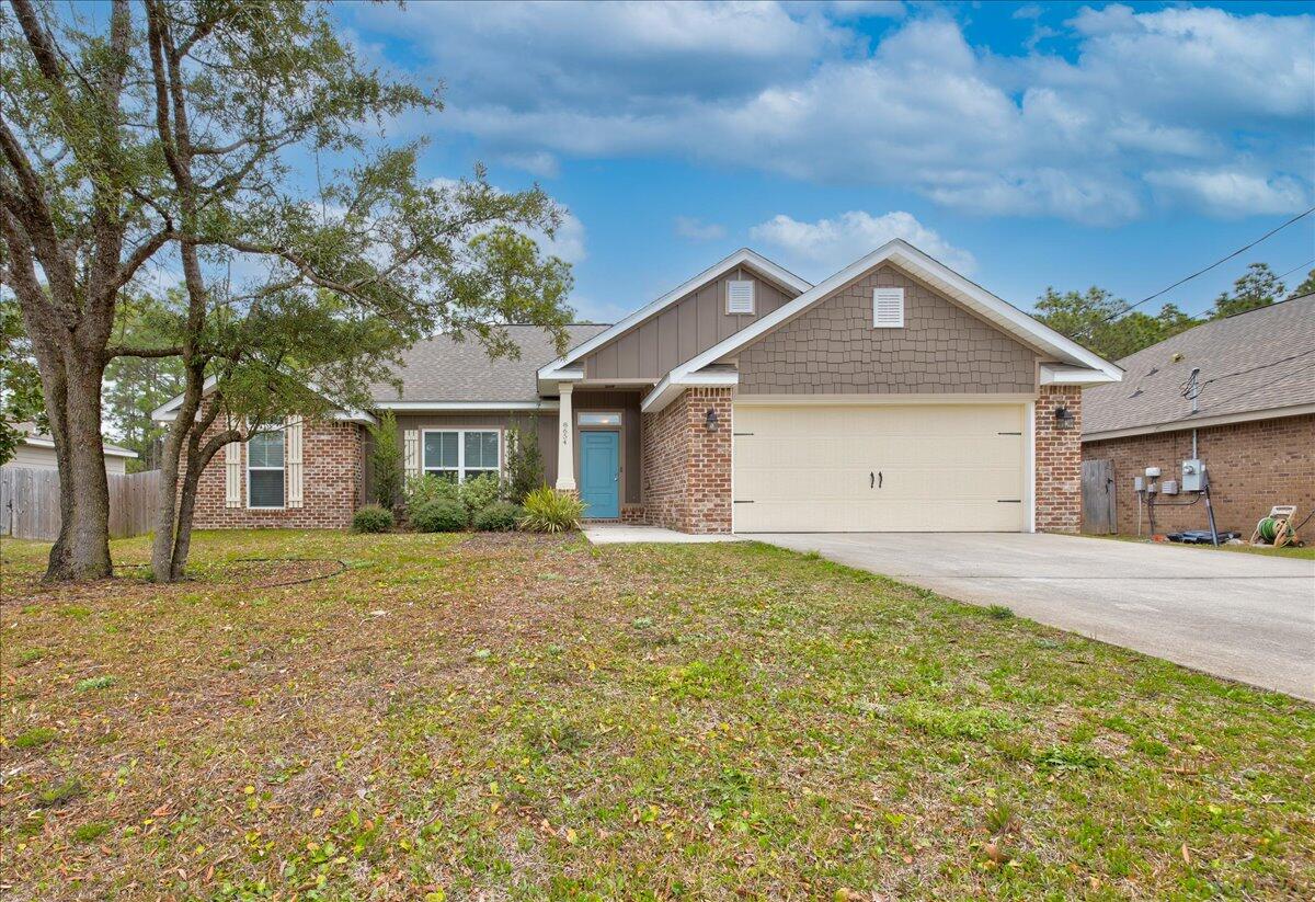 Previous buyer had financial emergency - back on the market! This gorgeous 4 bedroom, 2 bath brick home is conveniently located on a large, privacy-fenced lot with an easy commute to beaches, bases, schools, shopping, restaurants, and more. There is a spacious living room with recessed, color-changing lighting, which leads out to a covered back porch, and the kitchen has plenty of upgrades, including 2 walk-in pantries, granite counter tops, soft-close drawers, an island, breakfast bar, stainless appliances (complete with flat cooktop stove), reverse osmosis faucet, formal dining area, and more! This lovely home features a split floor plan for privacy, and the master boasts tray ceilings with its own en suite to include a granite double vanity, walk-in, tiled shower with rain shower head,