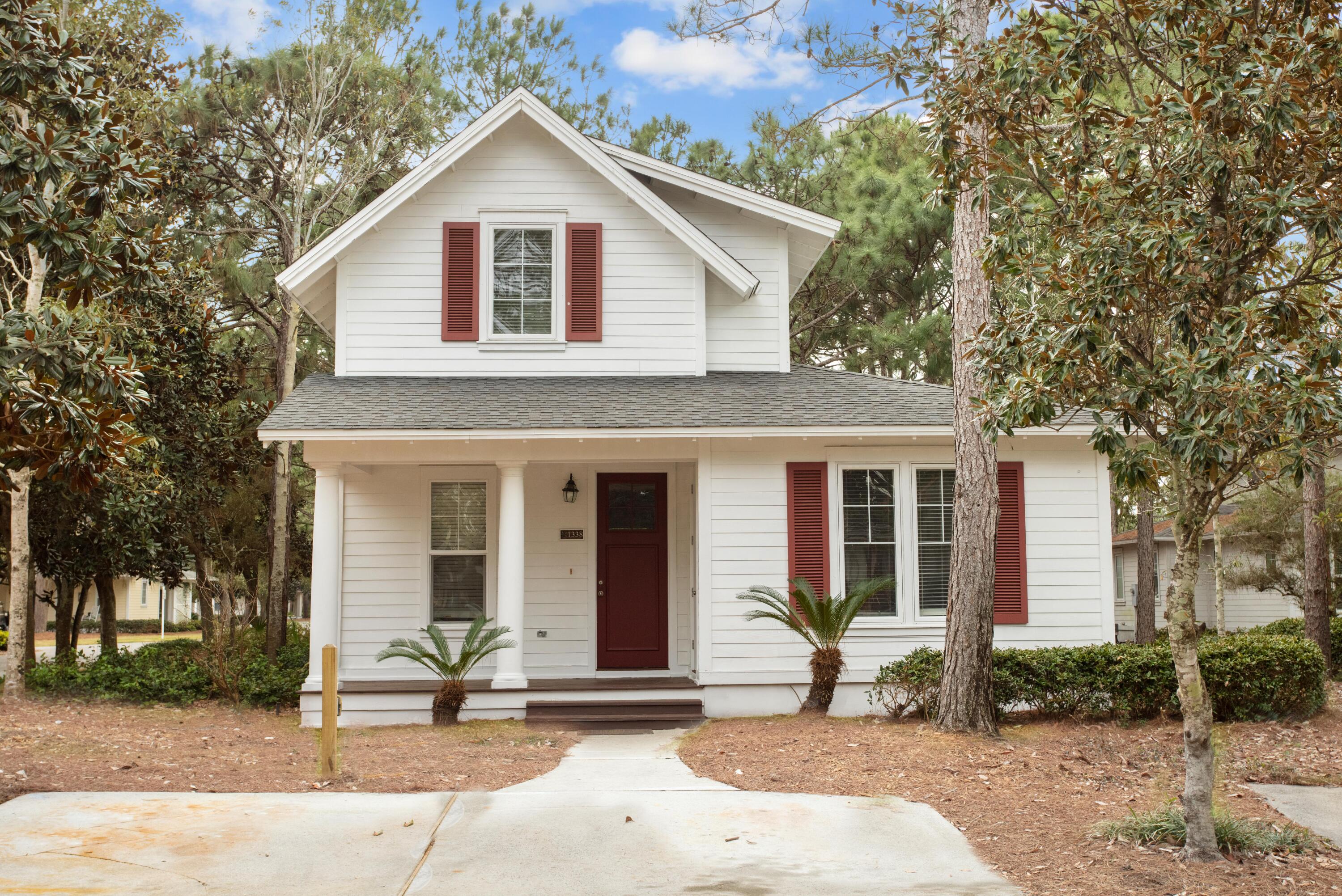 JUST REDUCED TO SELL!   New roof  installed 6/2023  Charming Florida Cottage located in the highly sought-after neighborhood of Laurel Grove. Located on a corner lot with a golf cart charging station, the home is situated on a lovely tree-lined street. Beautiful limestone floors grace the first level where there is an open and bright living and kitchen space perfect for entertaining guests. Enjoy stainless steel appliances paired with granite counters for a sleek kitchen appeal. Laurel Grove is a coveted community in Sandestin bounded by four spectacular holes of the award-winning Raven Golf Club. As a short-term rental capable community, this home can be used as a primary residence, second home or rental opportunity.