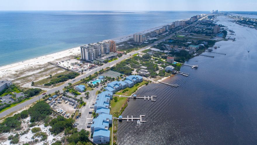 Beach and Boat lovers dream! This completely remodeled two bedroom two bath condo offers beautiful views of Old River overlooking Ono Island. Enjoy river views on your balcony and watch the boats and dolphins. It has deeded beach access directly across the street so you can enjoy the beautiful water and sugar white sands of the Emerald Coast. The property features pool, boat docks, and on site storage. This unit is being sold FULLY FURNISHED, move in or rental ready. Don't miss the opportunity to own a piece of Paradise.