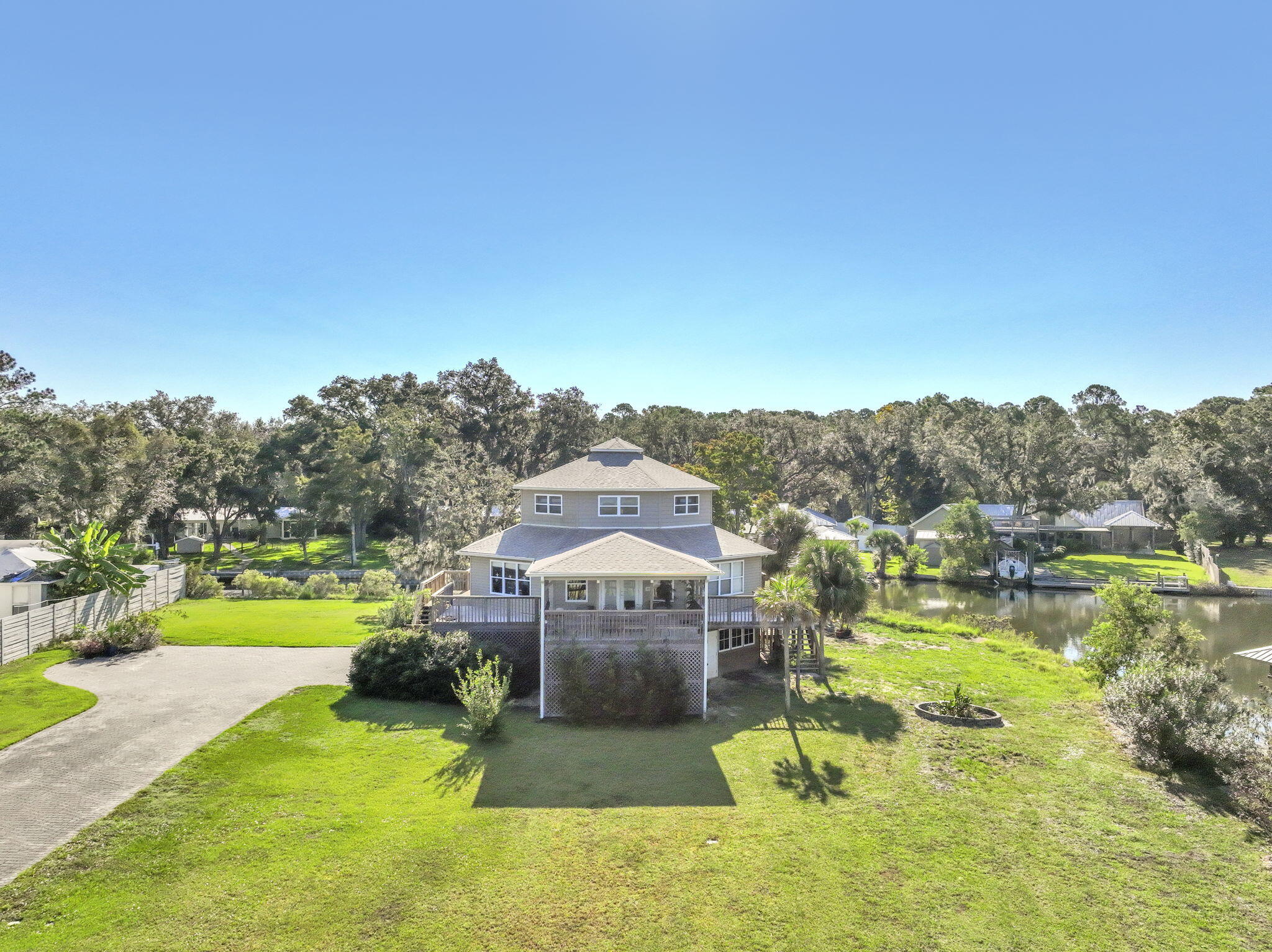 Set on 3/4 acre and surrounded by 300 feet of waterfront you have found your slice of paradise. This home is tucked away at the end of a dead end street but still close to all the conveniences of up and coming Freeport. Sit on your covered porch, watch the sunset and let the noise of the world be replaced with the sounds of nature. Or take your boat out from the covered boat dock and lift to watch the sunset over La Grange Bayou! It doesn't get any better than this!