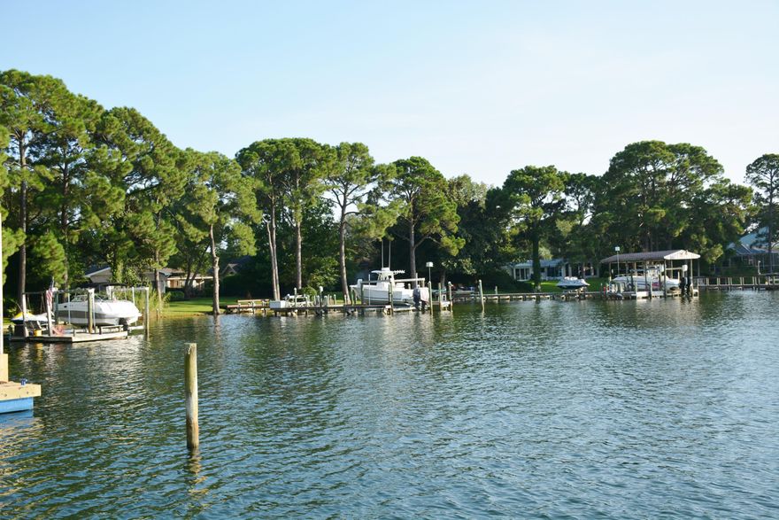 NEW PRICE!!!!!This lovely waterfront home is located on Cinco Bayou which is only a few miles from the sugar white sands and the crystalline green waters of the Emerald Coast. The property is close to both Eglin AFB and Hurlburt Field. This home was totally renovated to the studs in 2002 and a new dock and seawall were installed August 2016. The views of the Bayou are just amazing! The kitchen is open to the great room and French doors open to the deck. A spacious breakfast room over-looking the pool and lanai was added during the renovation period. The geothermal heater for the pool enables you to enjoy the water throughout the year. Buyer to verify all lot and home dimensions. Seller is providing a 1 year home warranty. Renovation upgrades are in the document section. The wood deck on the back of the house has built-in seating that expands your entertaining options.  The yard has mature landscaping that has been well maintained. The carpet was removed from the bedrooms and Florida Magnolia Cherry tile which looks like hardwood was installed in the bedrooms. Crown molding is in all the rooms except for 3 bedrooms.  The master bedroom features a tray ceiling. The master bath has separate vanity areas, a garden tub and separate shower. The fifth bedroom/ recreational room is very spacious and could used for many purposes . This home is a must to see!!! What are you waiting for?  Give me a call and I'll show you this lovely waterfront home!!!