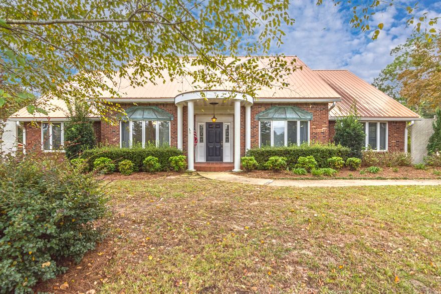 Location dream home! County setting near shopping schools and banks! Copper roof, patina copper accents all Brick Massive oaks, Dogwoods, and Magnolias abounding in golden sun rays surrounded by fenced and cross fenced pasture! This home has tile floors, metal roof, fire place lots of large windows and an attached two car garage. Located on nearly six pasture grass acres with a three stall horse barn with a Tac room, and a Chicken coup ( converted to a sitting room). Come home to 5869 Hillcrest Drive today!