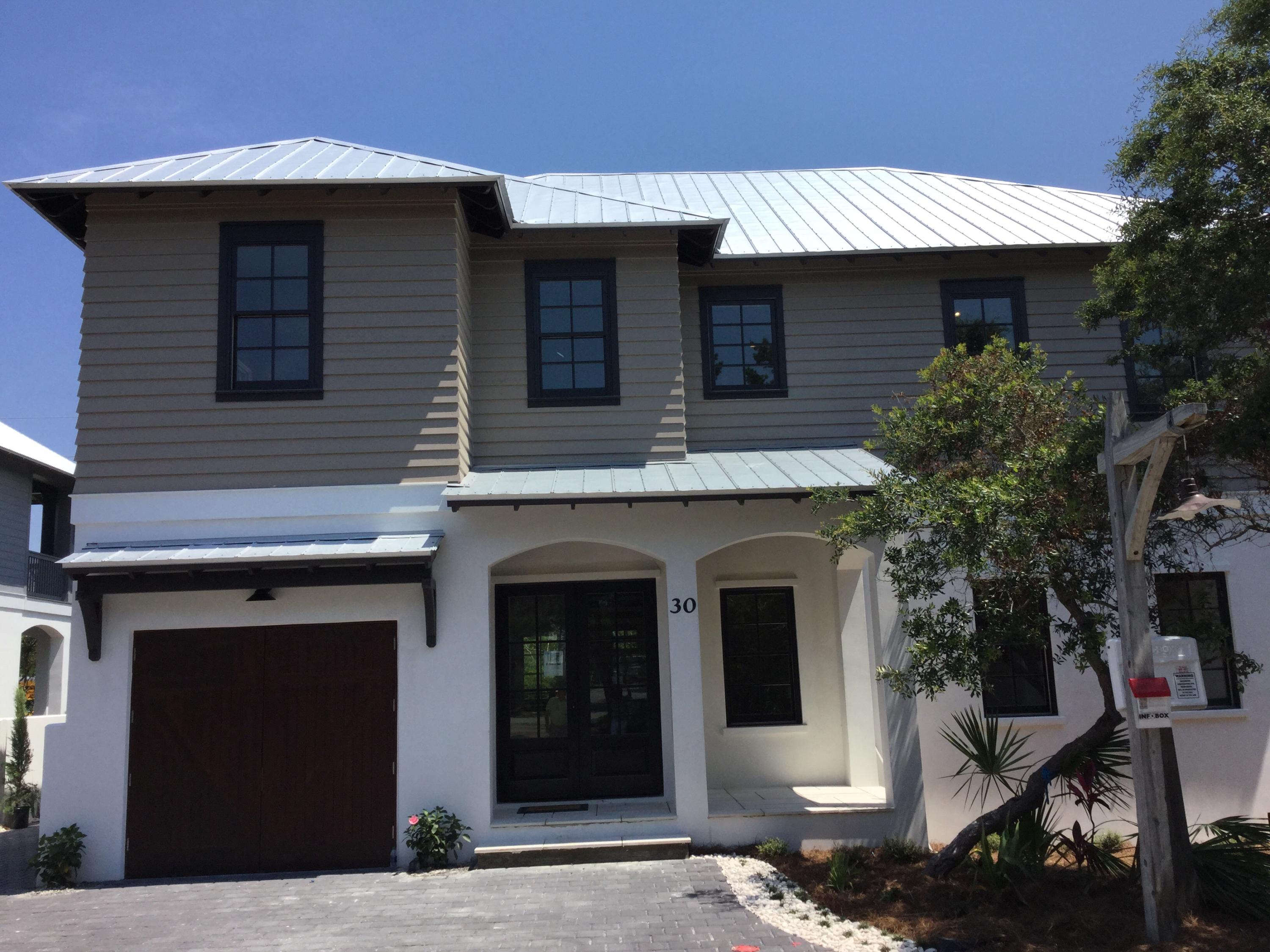 This beautiful, new construction home located in private,gated, Pinecrest (south side 30-A, next to Rosemary Beach) is a must see!5 bedroom, 5 1/2 bath, bonus room, 3 sets of bunk beds, sleeps 17! Features both a full 2 story living room & 2 story dining area. From the balcony above, gaze at the many elaborate finishes that make this home a real show place! Carrera marble, hardwood floors, fireplace, lighted, pecky cypress ceilings, barn accent doors, commercial like appliances & 1x8 wood, nickel spaced walls. Master bath with lighted barrel ceiling, large soaking tub, separate dual head(2 person)shower & walk-in closet. Garage area is heated/cooled, totally finished with a 12ft glass sliding door & can be used as an add recreation room. Stucco wall perimeter, too many amenities to list!