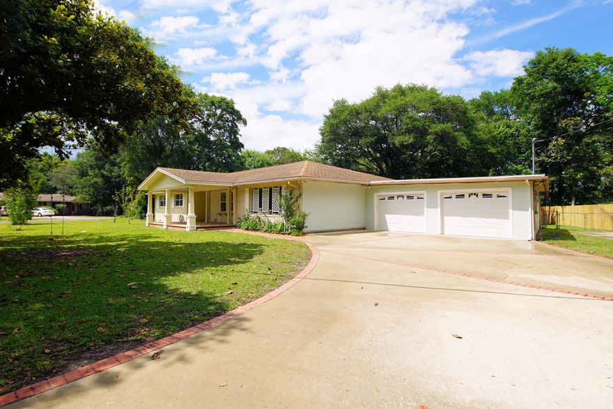 **THIS HOME HAS SOMETHING FOR EVERYONE!! ** This RENOVATED, SPACIOUS HOME is located close to Shopping, Restaurants, Schools and both Military Bases! Walking up to the Front Entry there is a LARGE COVERED PORCH which can easily fit several comfortable chairs to relax in while you sip a refreshing beverage and enjoy the Florida Weather! The interior of this home features BAMBOO FLOORING and TILE throughout the home  no carpet! The LIVING ROOM and DINING ROOMS are VERY LARGE and can hold all your furniture no matter how much you have! The KITCHEN has been FULLY REMODELED and features NEW CABINETRY, GRANITE COUNTERTOPS, STAINLESS APPLIANCES and a FULL-SIZE SIDE BY SIDE REFRIGERATOR/FREEZER! This Kitchen also has a WINE BAR area for Entertaining. The PANTRY and LAUNDRY ROOMS both have ADDITIONAL STORAGE available too.  BOTH BATHROOMS have been FULLY UPDATED with GRANITE, TRAVERTINE TILE, and GLASS SHOWER DOORS!  The 4th Bedroom has a HUGE CLOSET and is located on the opposite side of the HOME for Privacy.  There is also a LARGE FLORIDA ROOM facing the LARGE BACKYARD â€“ perfect for gaming tables or a quiet room for reading/relaxing!  A COVERED PATIO is just off the FLORIDA ROOM!  Nestled in on a LARGE CORNER LOT this 4 BEDROOM home has MATURE LANDSCAPING including LARGE TREES and FRUIT TREES (Peach, Nectarine, Pear!) and a SPRINKLER SYSTEM for ease of care!  THERE IS A ROOM/AREA FOR EVERY MEMBER OF YOUR FAMILY IN THIS HOME to find Peace and Privacy OR Gather together without being cramped!  In addition to all the space in the home, the 2 CAR GARAGE is OVERSIZED to easily fit both of your vehicles and still have room to walk around.  There is also an additional Concrete Pad that you could PARK your RV or BOAT!!  Make sure to put this home on your list of MUST SEE properties!