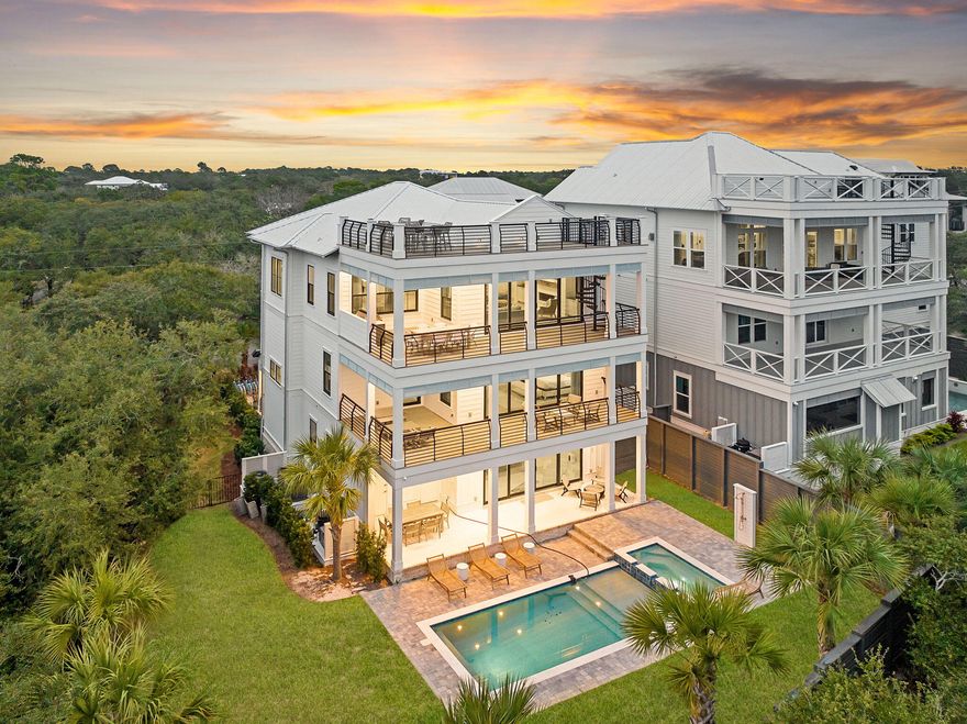 Rising four stories above the surrounding landscape, 133 Bullard Road is a carefully considered coastal residence defined by elevation, proportion, and long term relevance. The home's vertical design is deliberate, allowing each level to engage light, air, and view corridors in a way that enhances both daily living and architectural presence. From its upper floors, the home captures layered vistas across the protected dunes of Topsail Hill Preserve State Park and extending to the Gulf of Mexico. These sightlines are not only striking, but enduring, safeguarded by the permanence of adjacent state owned land. This natural preservation creates a rare sense of privacy and openness while securing the integrity of the views for generations to come.

Interior and exterior spaces unfold vertically, offering a thoughtful balance between private living quarters and open gathering areas. Multiple balconies and elevated outdoor spaces extend the home beyond its walls, reinforcing a strong connection to the surrounding environment while allowing the residence to live comfortably at scale.

Situated in Santa Rosa Beach, the property benefits from proximity to the beaches, dining, and cultural rhythm of the 30A corridor, yet remains distinctly set apart. The elevation of the home and its relationship to preserved land create a sense of calm and separation that is increasingly difficult to find.

Four story homes with Gulf views and direct adjacency to protected state land are exceptionally rare along this stretch of coast. 133 Bullard Road represents a refined opportunity as a primary residence, a second home, or a long term coastal holding where architecture, setting, and permanence align.