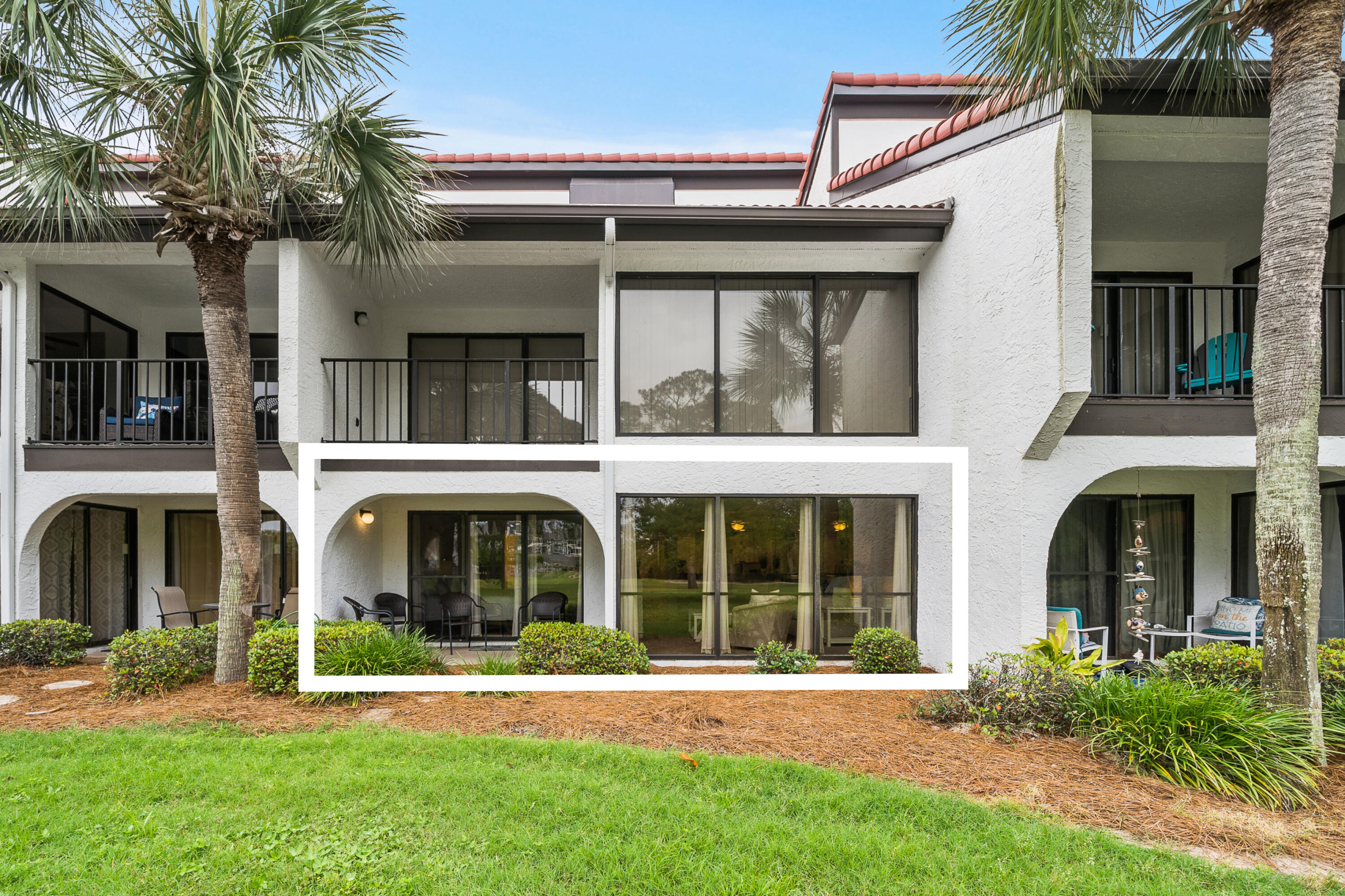 Tucked into one of Edgewater's most desirable enclaves, this ground-floor golf villa offers a rare blend of privacy, convenience, and resort-style amenities--all without the bustle of traffic or crowds. Located in the coveted 700s building, the unit--currently the best-priced in the community--faces a peaceful wooded landscape with tranquil pond and golf course views. Step just a few feet from your reserved parking spot and enter a thoughtfully updated interior. Ceramic tile flooring throughout the main areas makes sandy cleanups a breeze, and a full bath near the entry is perfect for post-beach rinses. The kitchen, renovated in 2022, showcases new cabinetry, sleek granite counters, stainless appliances, and a pass-thru bar ideal for casual entertaining.