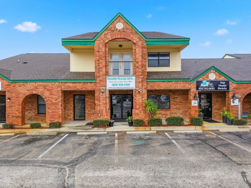 Prime Commercial Opportunity in Navarre's Premier Business Corridor!Harvest Village is a highly sought-after office/retail complex prominently positioned directly on Highway 98, offering excellent visibility and accessibility in the heart of Navarre. This professional commercial building features approximately 3,484 total square feet, thoughtfully designed across two levels that can be leased together or separately, providing outstanding flexibility for investors or owner-users. The first floor (1,702 sq ft) offers a welcoming lobby/reception area accented with crown molding, five private offices/rooms, a kitchen area, and three bathrooms with granite finishes--ideal for medical, professional, or service-based businesses. The second floor (1,682 sq ft) has its own private entrance and is The second floor (1,682 sq ft) has its own private entrance and is equally impressive, featuring a large reception area with an elegant trey ceiling, three spacious rooms with closets (including a walk-in), a full bath with tub/shower, and a full kitchen complete with stove, microwave, and refrigerator. Step outside to enjoy a private balcony, perfect for relaxing or taking in views of the professional complex below. Harvest Village has a strong history of successful occupants including dentists, chiropractors, title companies, spas, and massage therapy practices. An added bonus: the upper level's full kitchen and bath allow for the unique option of operating a business downstairs while residing or maintaining private quarters upstairs, subject to applicable use and zoning. This is an income-producing property currently generating over $4,300 per month. The complex offers ample parking, access to a digital sign on Highway 98 (advertising fee applies), and is surrounded by other established professional businesses. Association dues are $550 per quarter and include common area maintenance, lawn care, street lighting, and trash service, all managed by the Harvest Village Association making ownership truly low-maintenance. Whether you're an investor or a business owner seeking a high-visibility, versatile commercial space, this exceptional property offers location, functionality, and income potential in one outstanding package.
