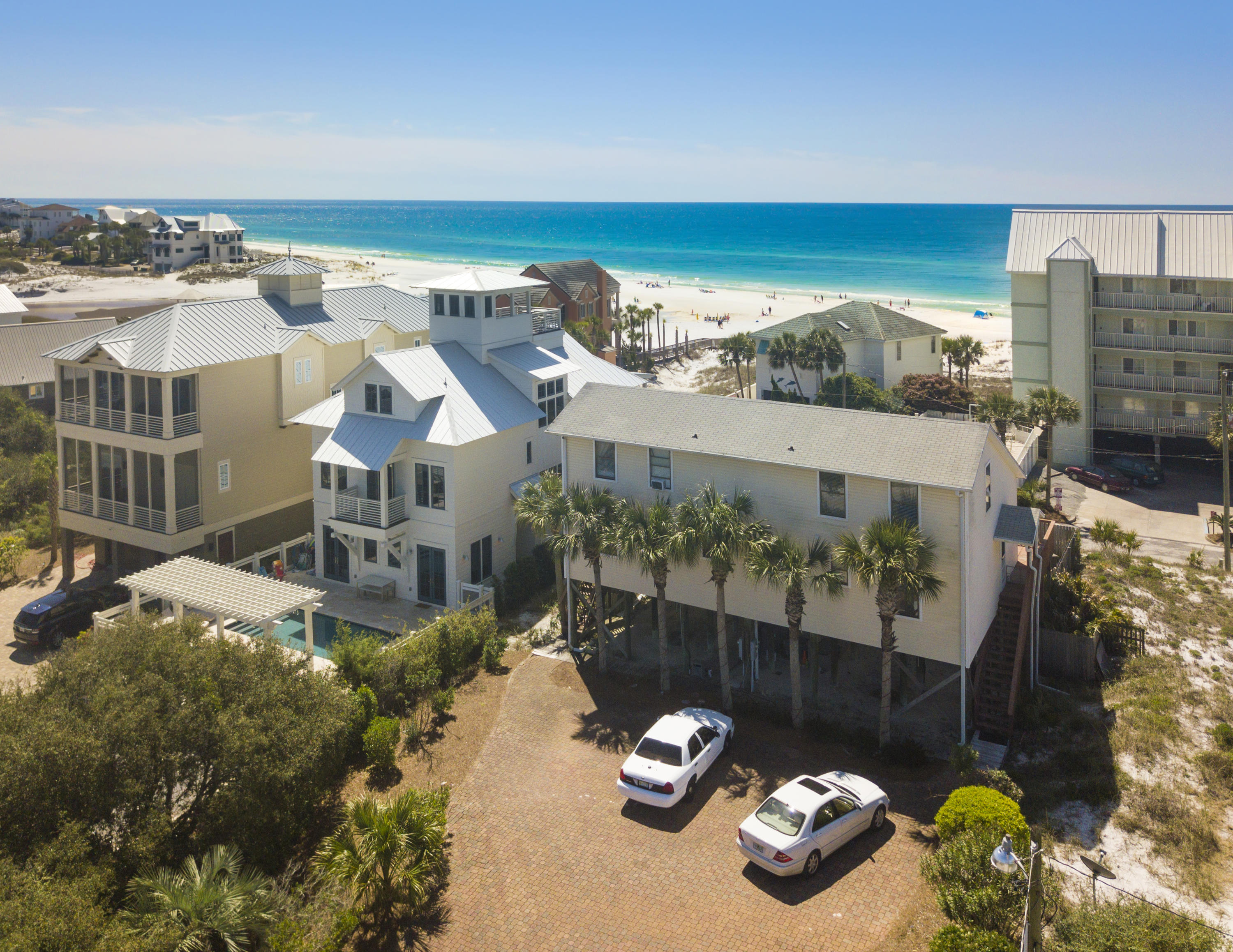 Gulf Views and Large swimming pool. It is one lot off the Beach. Large lot with lots of parking .Would be an excellent short term rental and has room to add additional guest quarters . The location is ideal for beach access and also to Eastern Lake. It was once a duplex and can easily be converted back to a duplex.